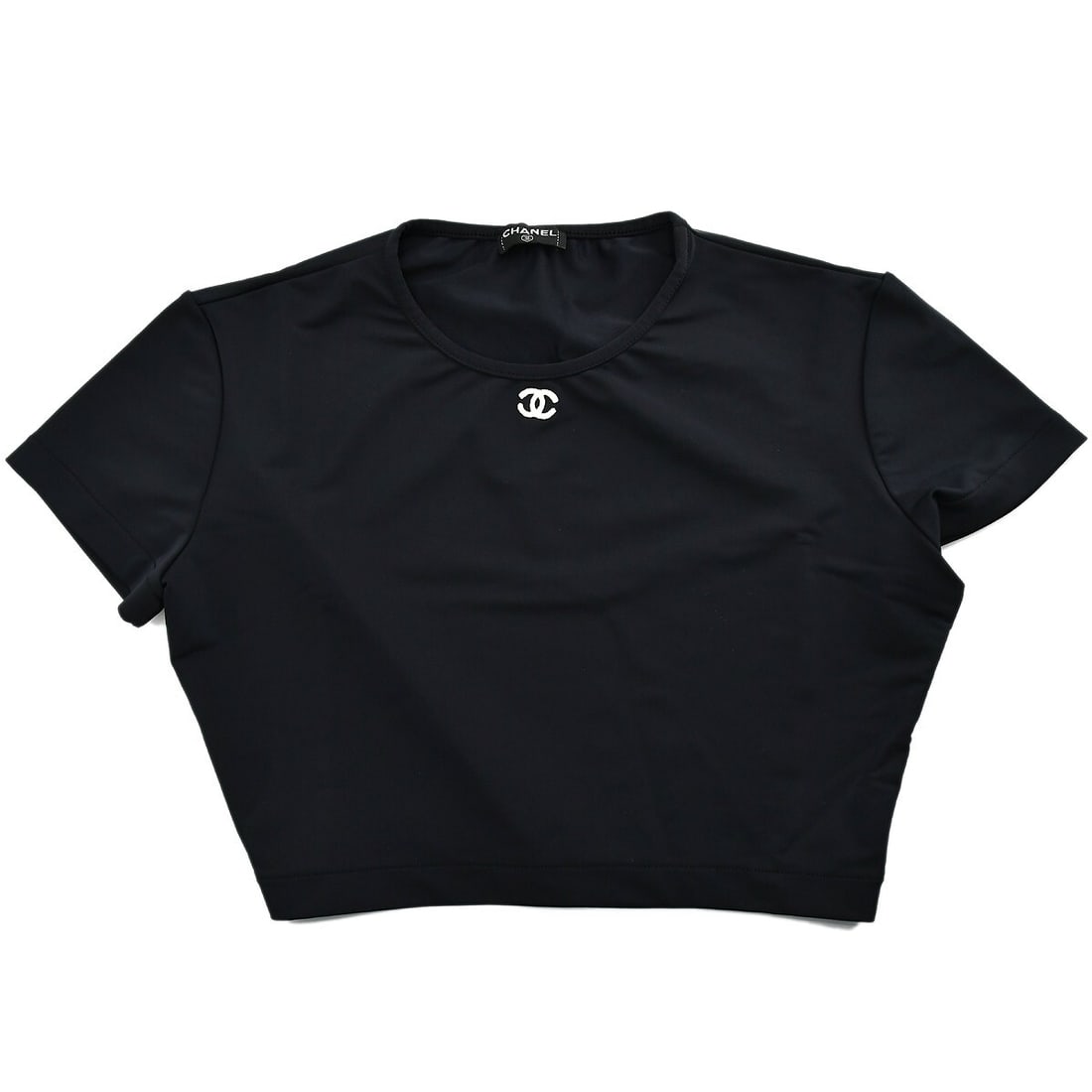 CHANEL Black Cropped T Shirt Size 42: CHANEL Black Cropped T Shirt Size 42 Black cropped T-shirt from France with a round neckline and short sleeves. Designed for women in a regular fit, this casual top is made from a stretch blend for a 
