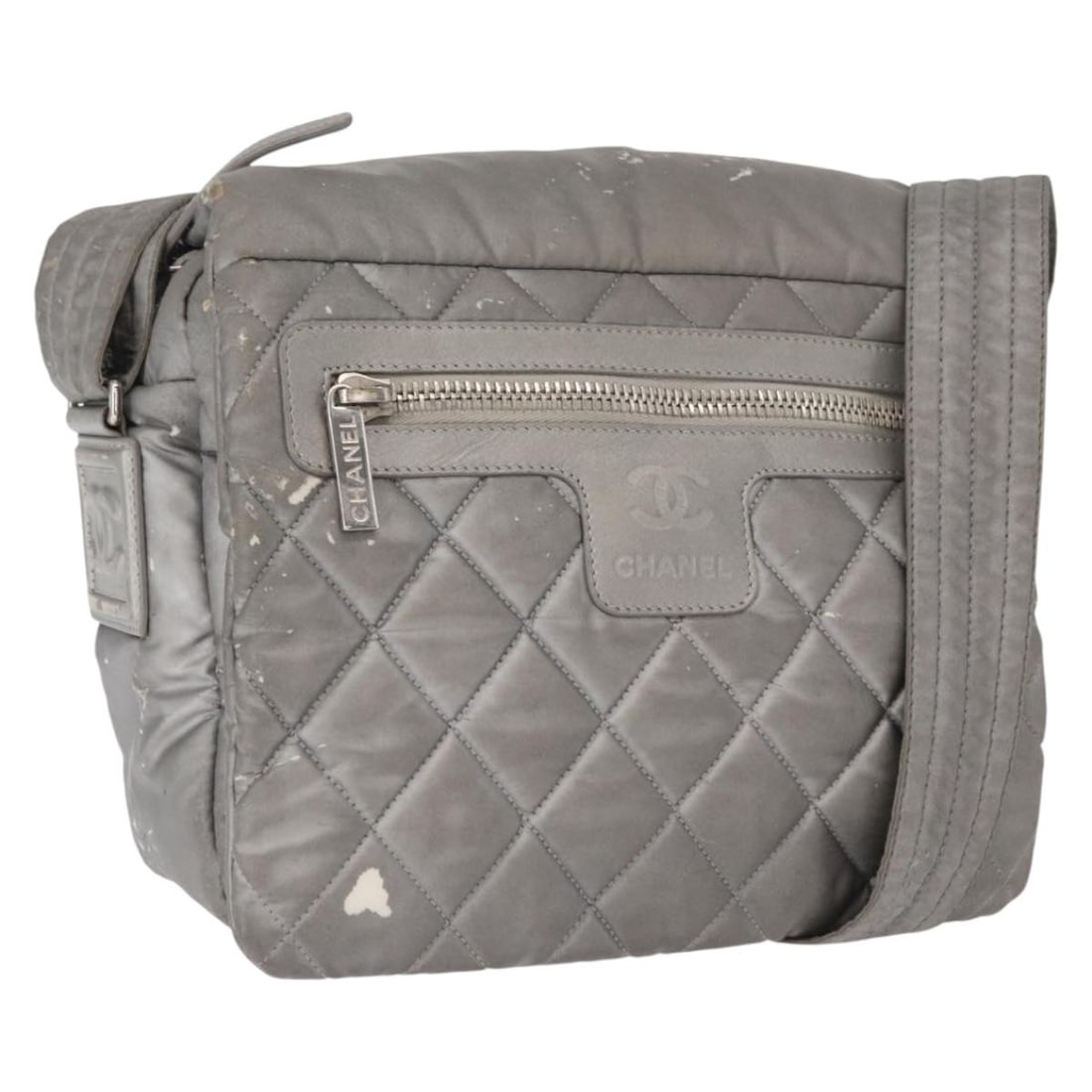 Chanel Cocoon Gray Silver Nylon Shoulder Bag with CC Logo: Chanel Cocoon Gray Silver Nylon Shoulder Bag with CC Logo This CHANEL Cococoon shoulder bag features gray and silver nylon with silver-tone CC accents. The bag includes a spacious interior and an adju