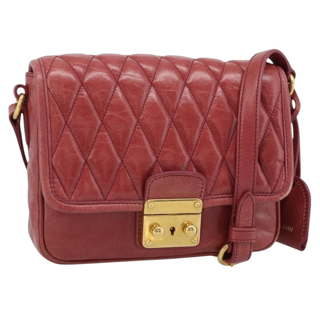 Miu Miu red leather shoulder bag with clochette gold tone: Miu Miu red leather shoulder bag with clochette gold tone Red leather Miu Miu shoulder bag with gold-tone accents and an included clochette. This women's bag is made in Turkey and shows heavy use, inc