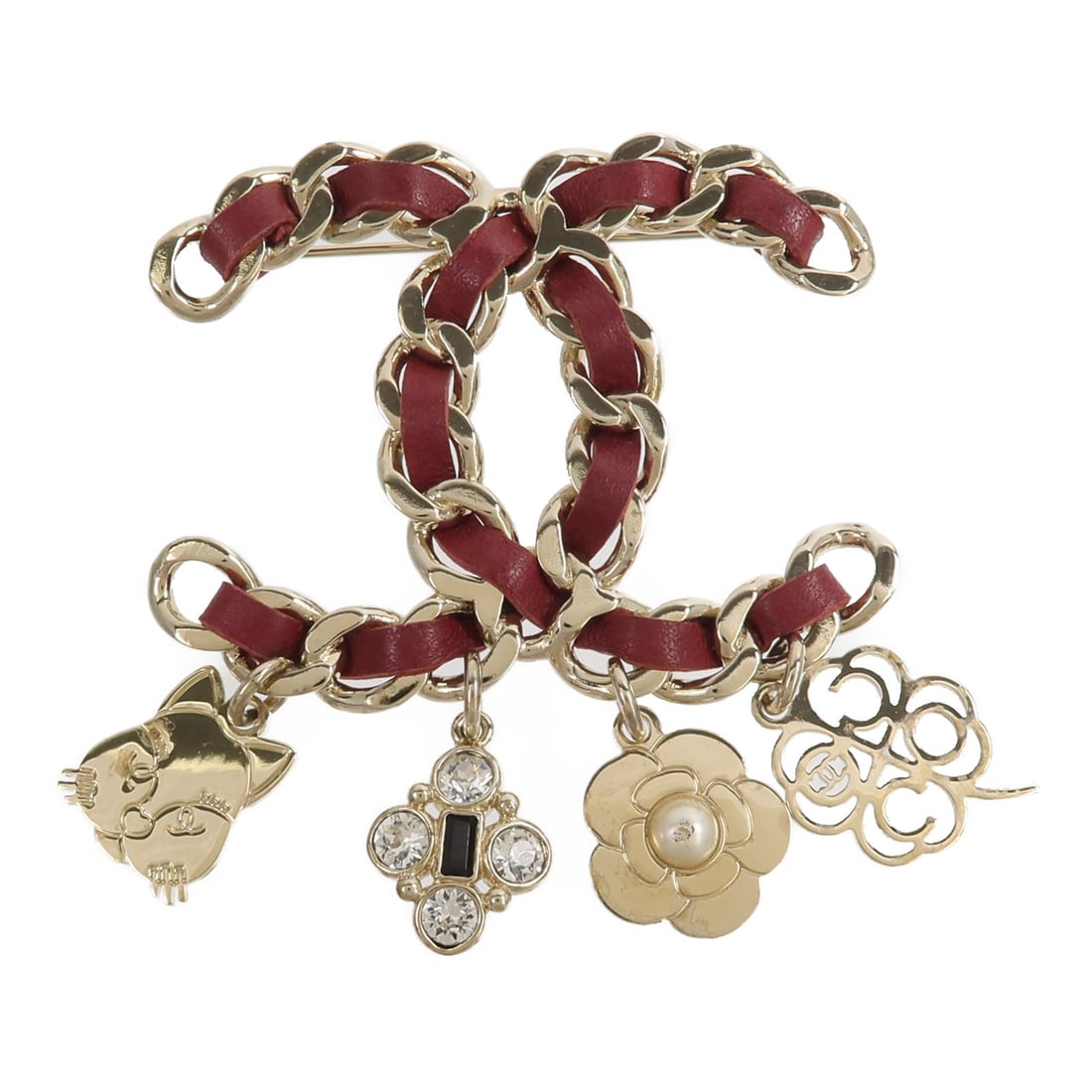 CHANEL G17B CC Brooch Leather Metal Gold Bordeaux: CHANEL G17B CC Brooch Leather Metal Gold Bordeaux CHANEL CC brooch in leather and metal with a gold and bordeaux colorway. Made in France, this women's brooch features the iconic CC motif and is prese