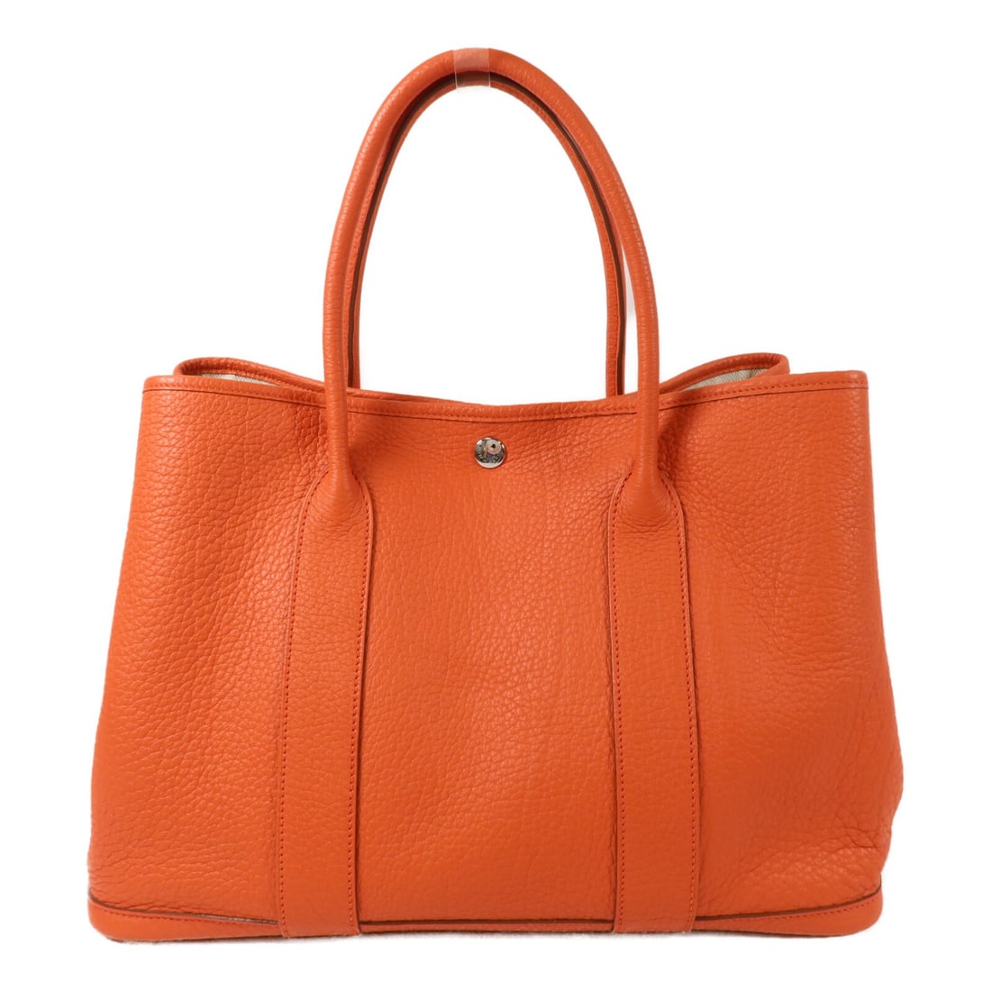 Hermes Garden Party PM Orange Negonda Leather Handbag PHW: Hermes Garden Party PM Orange Negonda Leather Handbag PHW Hermes Garden Party PM handbag in Feu Orange Negonda leather with palladium-tone hardware. This women's handbag is made in France and features