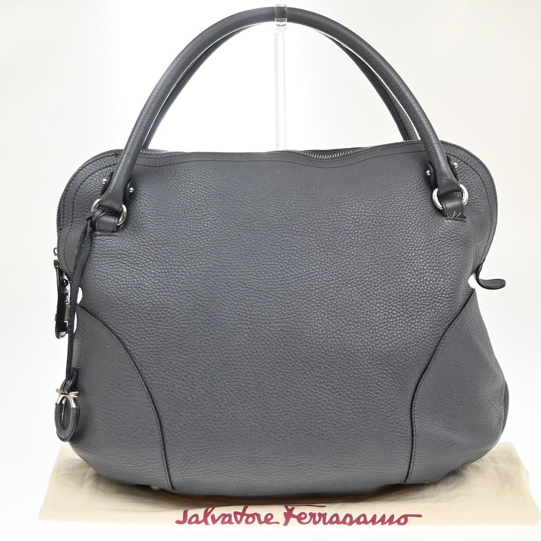 Bonaria Gray Leather Satchel by Salvatore Ferragamo Italy: Bonaria Gray Leather Satchel by Salvatore Ferragamo Italy This Salvatore Ferragamo Bonaria Satchel is crafted from gray leather and designed for women. The bag shows cracks on the handle edge leather 