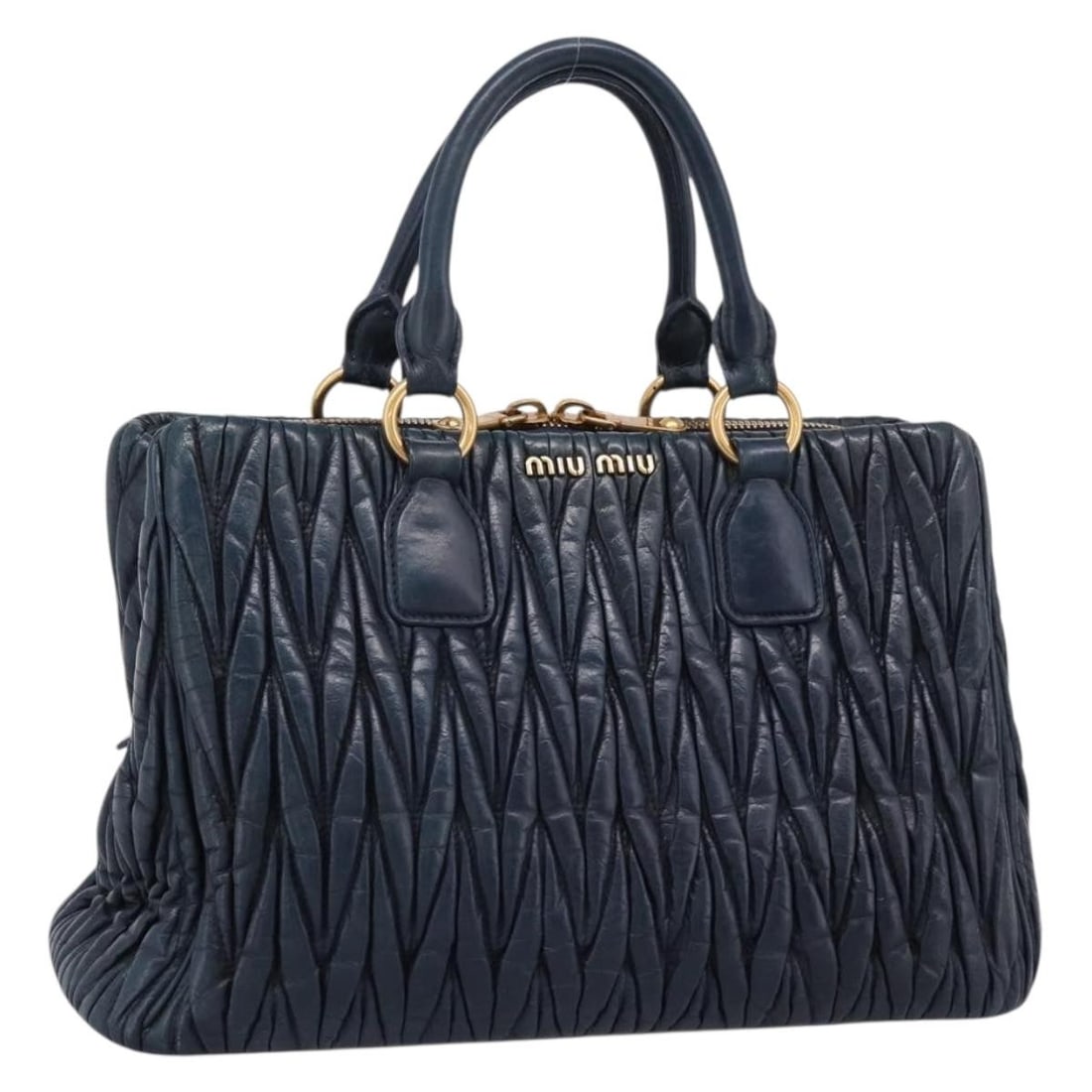 Miu Miu leather 2way handbag in navy with gold tone strap: Miu Miu leather 2way handbag in navy with gold tone strap Miu Miu matelasse 2-way handbag in navy leather with gold-tone accents. This women's bag includes a shoulder strap and can be carried by hand 