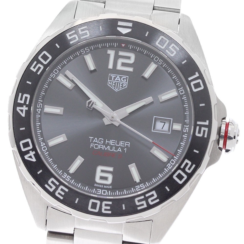 TAG Heuer Formula 1 Caliber 5 Automatic Date Mens Watch WAZ2011 BA0842: TAG Heuer Formula 1 Caliber 5 Automatic Date Mens Watch WAZ2011 BA0842 Pre-owned TAG Heuer Formula 1 Date Caliber 5 automatic men's wristwatch with a stainless steel case and bracelet. This watch feat