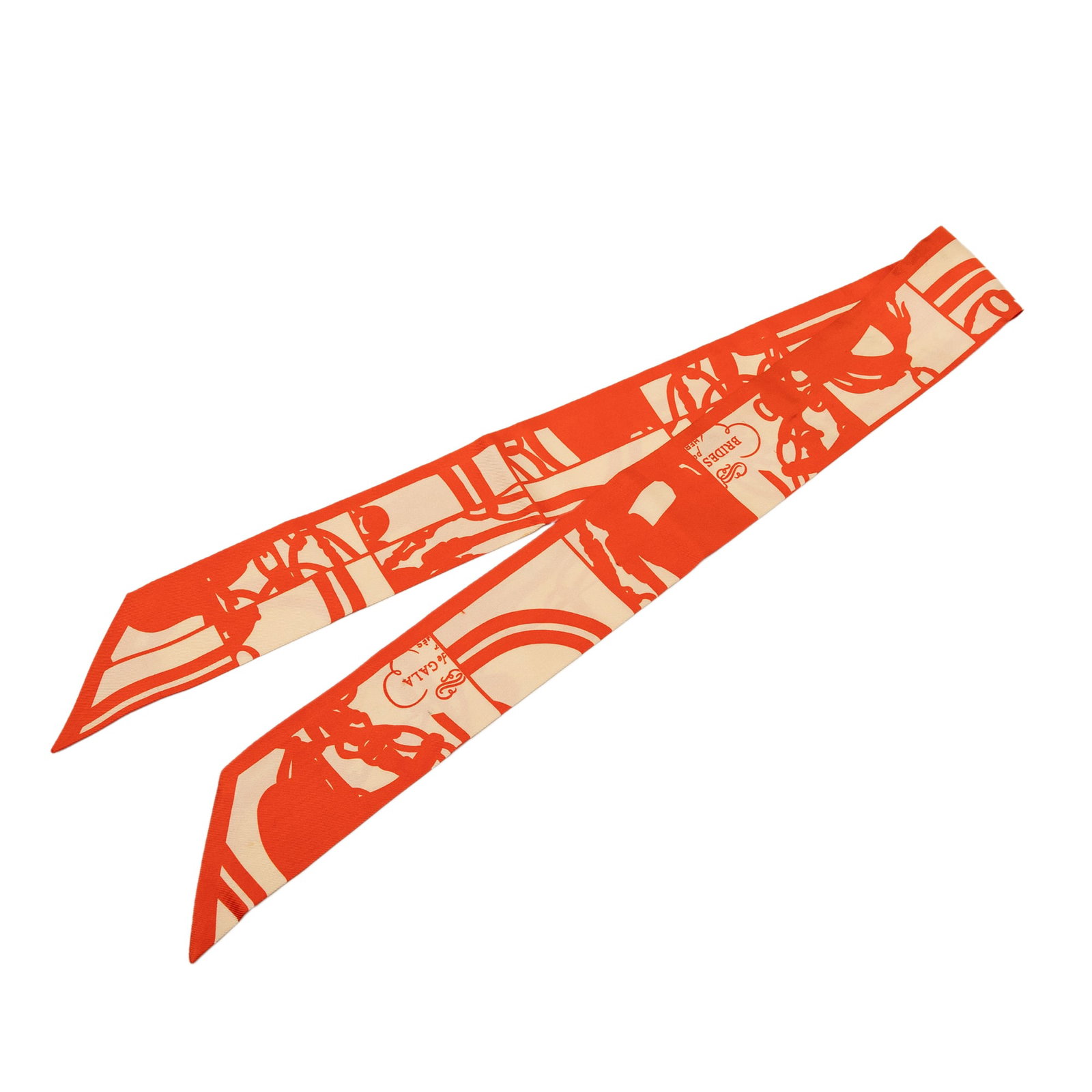 Hermes Brides De Gala Shadow Twilly Silk Scarf Orange: Hermes Brides De Gala Shadow Twilly Silk Scarf Orange Hermes Brides De Gala Shadow Twilly scarf crafted in 100% silk with an orange printed design. Made in France, this accessory shows loose stitching