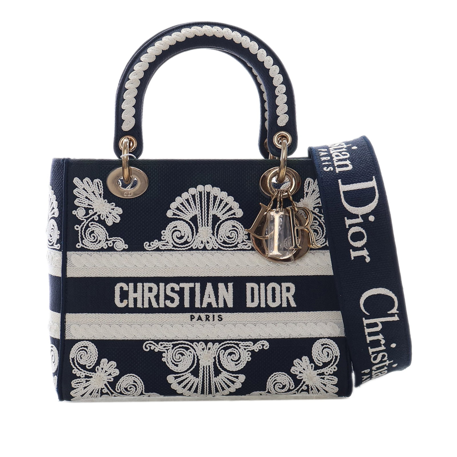 Dior Lady D Lite Medium Cornely Embroidered Canvas Bag: Dior Lady D Lite Medium Cornely Embroidered Canvas Bag The Lady D-Lite is a medium handbag crafted in embroidered canvas with structured handles, a detachable flat strap, a fold-in flap closure, and i