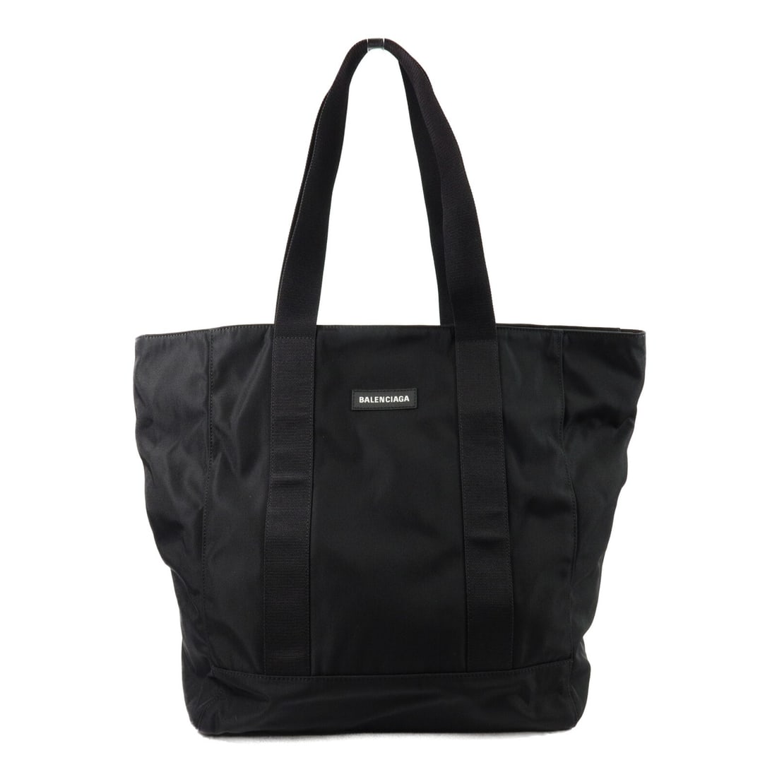BALENCIAGA 567032 nylon tote in black with storage bag: BALENCIAGA 567032 nylon tote in black with storage bag Balenciaga tote bag in black nylon with a spacious everyday silhouette and an interior zip pocket for organized storage. This unisex tote include