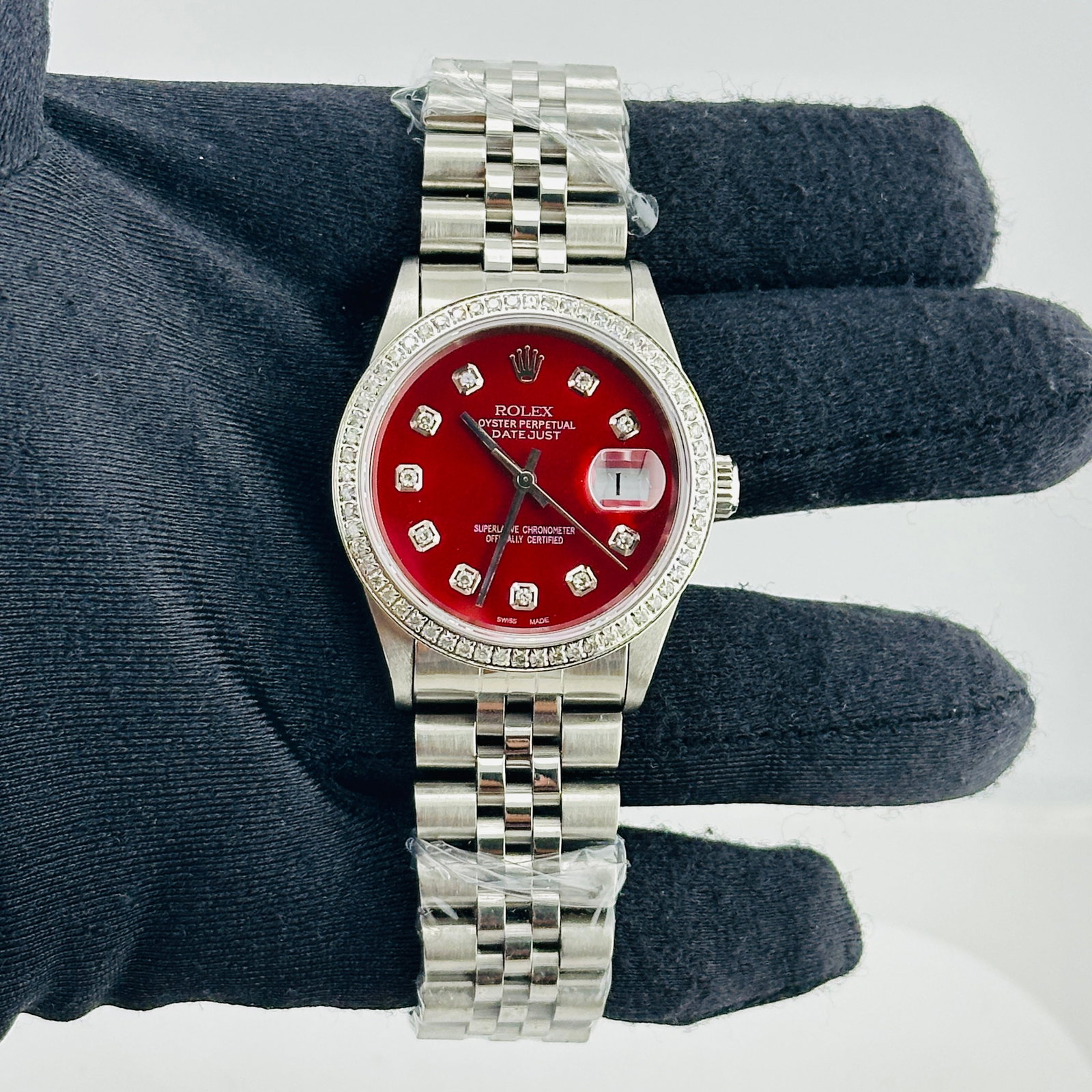 Rolex Datejust Ref. 16200 Mens Watch Red Diamond Dial aftermarket Jubilee Bracelet: Rolex Datejust Ref. 16200 Mens Watch Red Diamond Dial aftermarket Jubilee Bracelet Rolex Datejust reference 16200 with an Aftermarket red diamond dial, pave diamond bezel, and Aftermarket Jubilee brac
