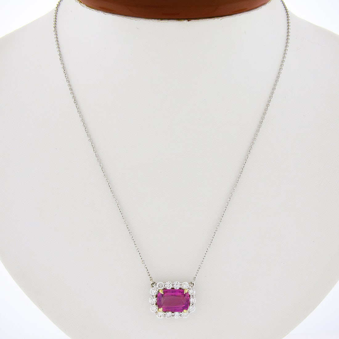 18K Gold GIA Certified 5.24ctw Pink Sapphire Diamond Halo Necklace: 18K Gold GIA Certified 5.24ctw Pink Sapphire Diamond Halo Necklace This exquisite pendant necklace features a stunning GIA certified cushion brilliant cut pink sapphire, weighing 4.14 carats, set in a