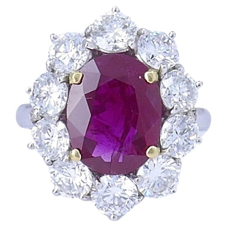 14k White Gold Ruby Diamond Cluster Ring Burma AGL Report: 14k White Gold Ruby Diamond Cluster Ring Burma AGL Report This vintage cocktail cluster ring is crafted in 14k white gold and features an approximately 3.40-carat oval faceted Burma ruby at the center