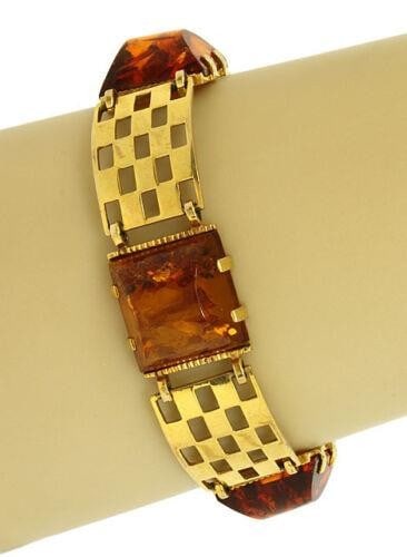 Vintage 8k Yellow Gold Amber Ladies Bracelet Open Style: Vintage 8k Yellow Gold Amber Ladies Bracelet Open Style This vintage 8k yellow gold bracelet is beautifully designed with a stylish open style panel link. It features genuine amber gems that enhance i