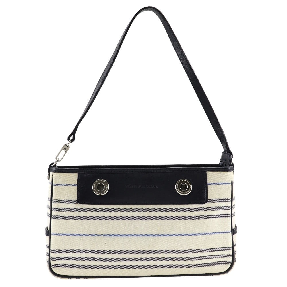 Burberry Vintage Beige Canvas Shoulder Bag 26cm: Burberry Vintage Beige Canvas Shoulder Bag 26cm This Burberry vintage shoulder bag is crafted from beige canvas and designed for women. The bag features minor stains on the exterior and interior, a pe