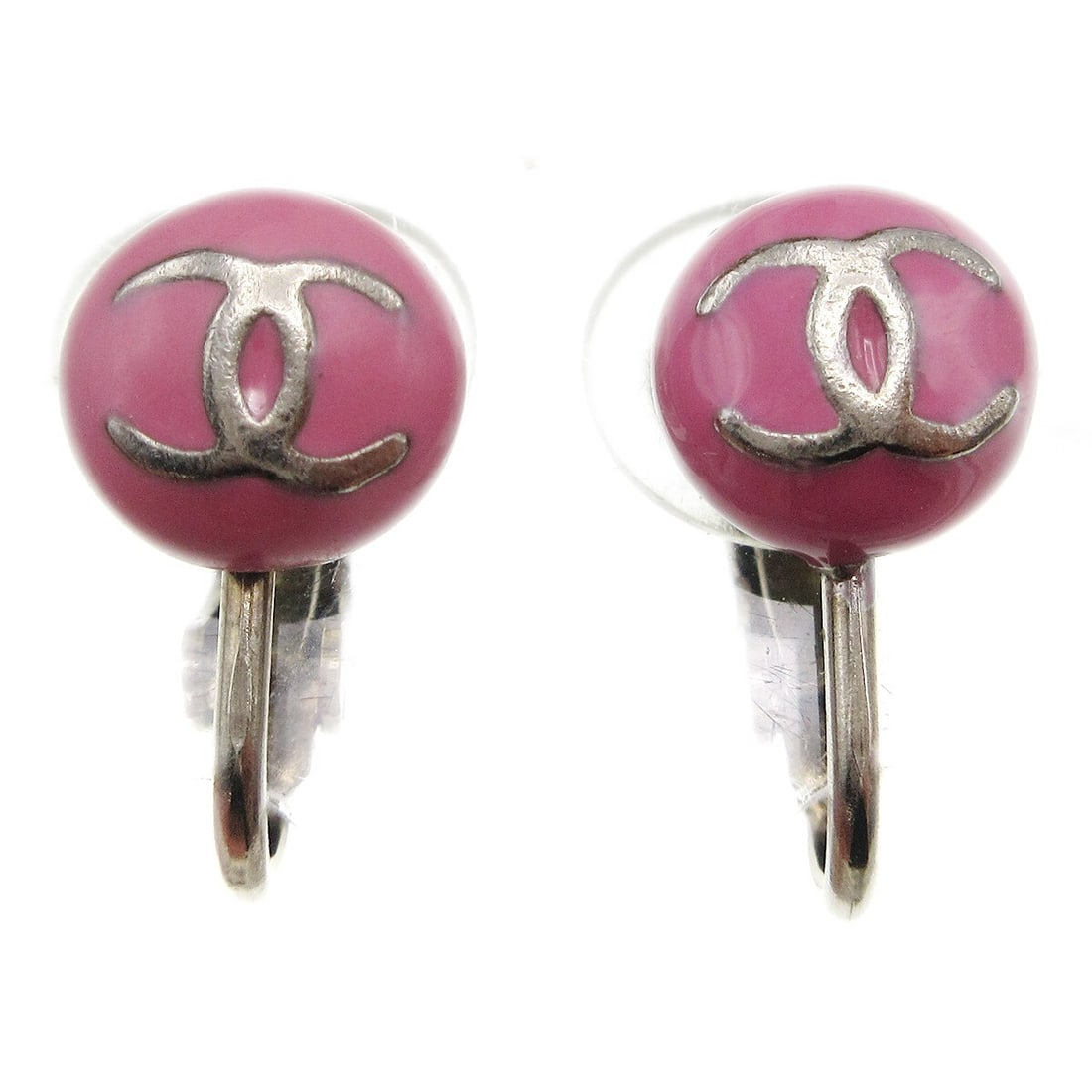 Chanel 03C Pink Button Clip-On Logo Earrings: Chanel 03C Pink Button Clip-On Logo Earrings Clip-on Chanel button earrings in pink with the iconic logo design. Made in France, this pair features a plastic and acrylic body with silver-plated gold-t