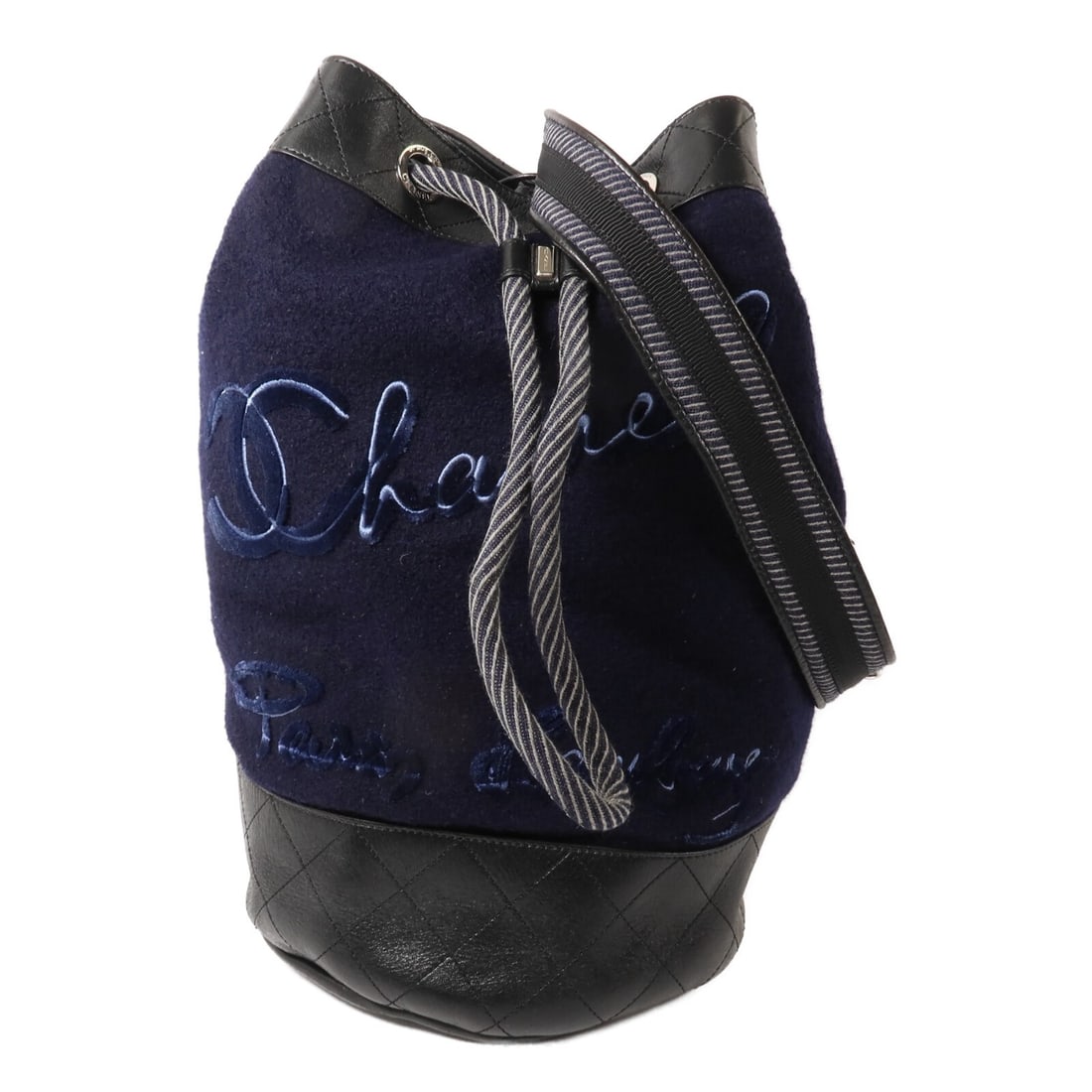 CHANEL CC Drawstring Chain Shoulder Bag Navy Black Wool Calfskin: CHANEL CC Drawstring Chain Shoulder Bag Navy Black Wool Calfskin CHANEL drawstring sling chain shoulder bag in navy and black wool and calfskin. This unisex shoulder bag features a CC design, chain sh