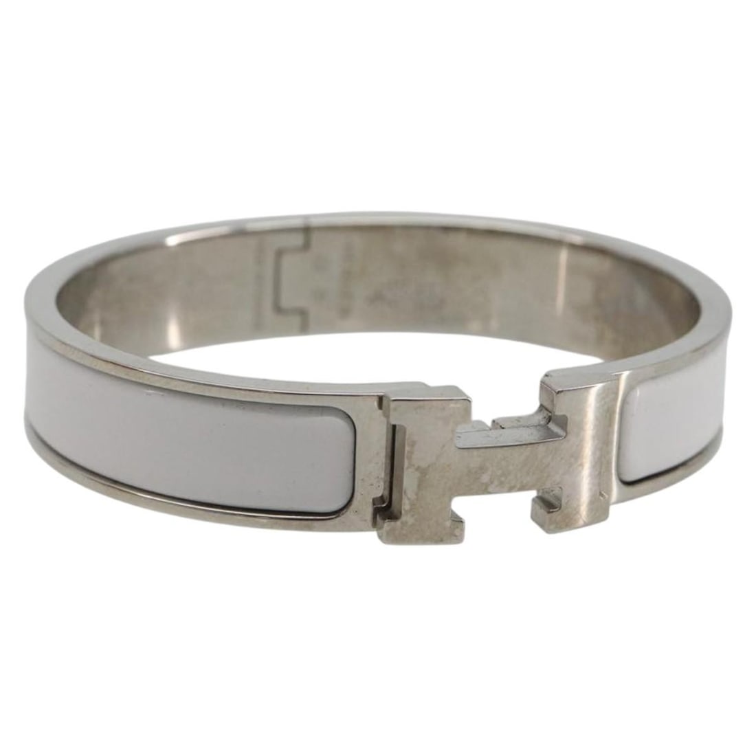 Hermes Click H White Metal Bracelet with Dust Bag Box: Hermes Click H White Metal Bracelet with Dust Bag Box Hermes Click H bracelet in white metal with a clean, structured design. Made in France, this women's bracelet includes the dust bag and item box. 