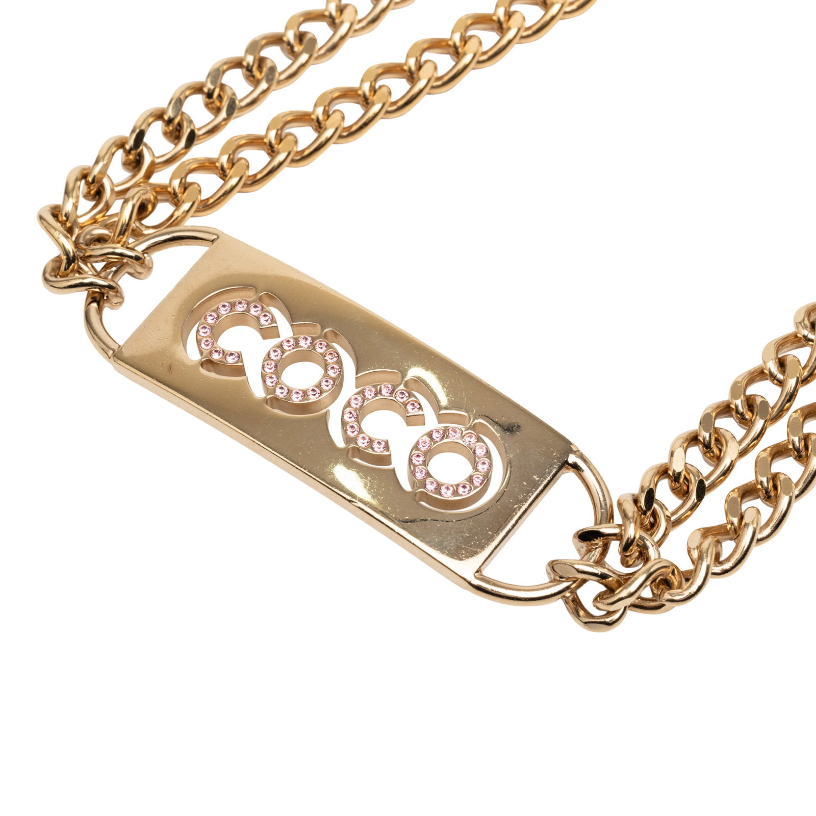 Chanel crystal plaque chain belt gold tone metal: Chanel crystal plaque chain belt gold tone metal This Chanel belt features a gold-tone metal construction accented with crystal embellishments. It is designed with a double chain and secures with a lo