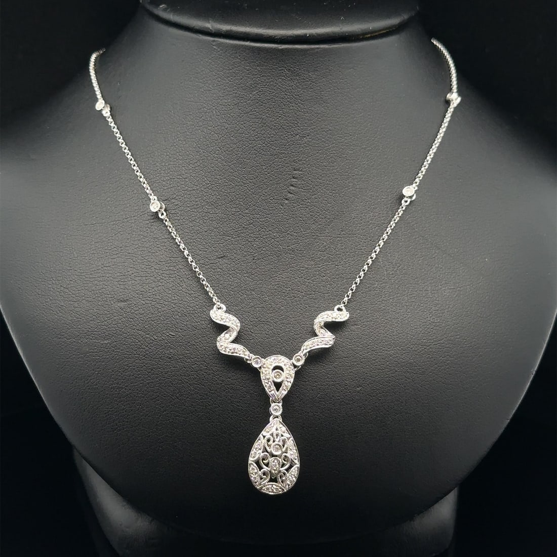 Elegant 16 Inch White Gold Teardrop Necklace with 0.23ct Fancy Diamonds: Elegant 16 Inch White Gold Teardrop Necklace with 0.23ct Fancy Diamonds This elegant necklace features a captivating Y-drop design, showcasing a stunning array of (47) natural genuine diamonds. Each r