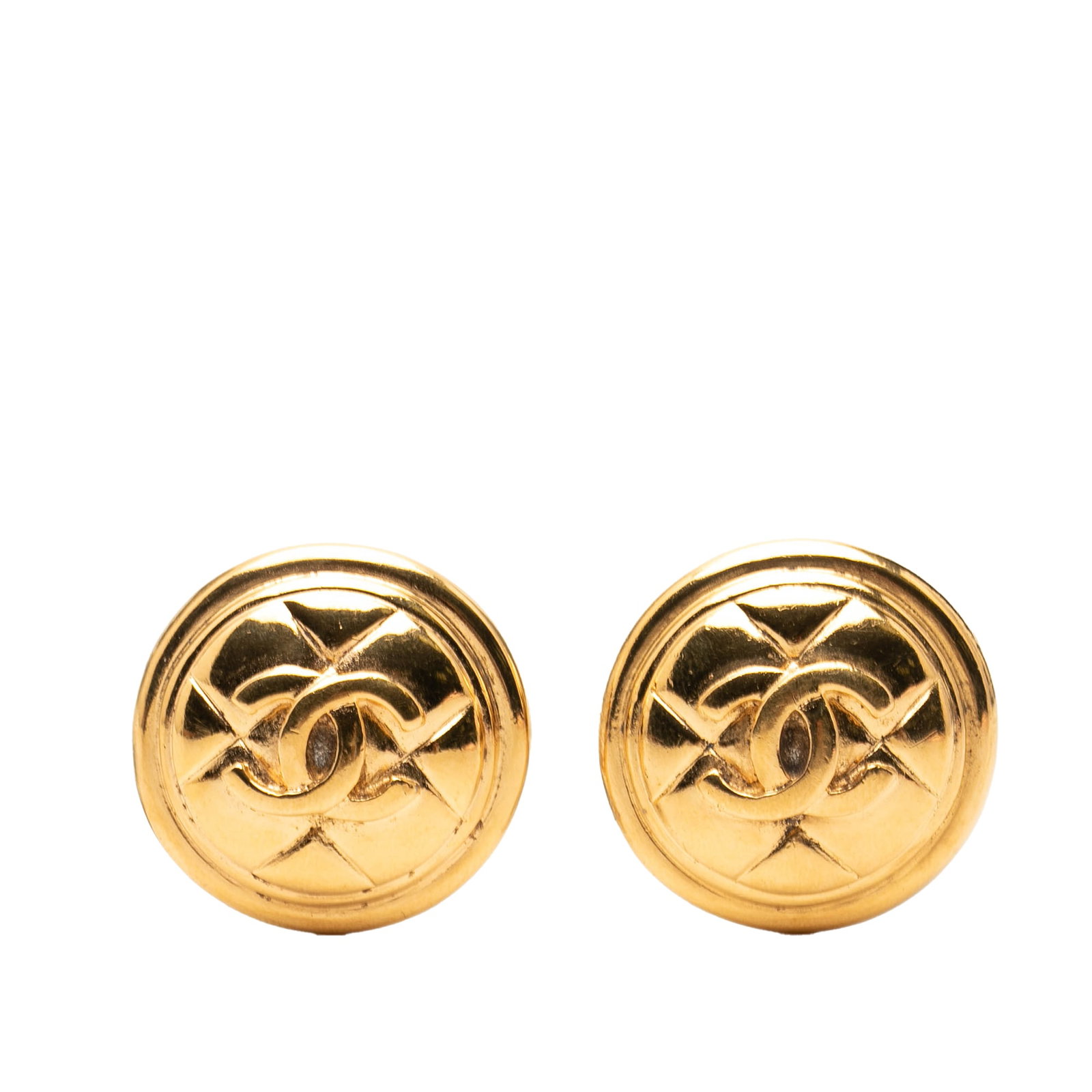 Chanel CC Round Clip On Earrings Gold Plated Quilted Metal: Chanel CC Round Clip On Earrings Gold Plated Quilted Metal Round Chanel clip-on earrings with a quilted CC design in gold plated metal. These costume jewelry earrings were made in France. Condition is