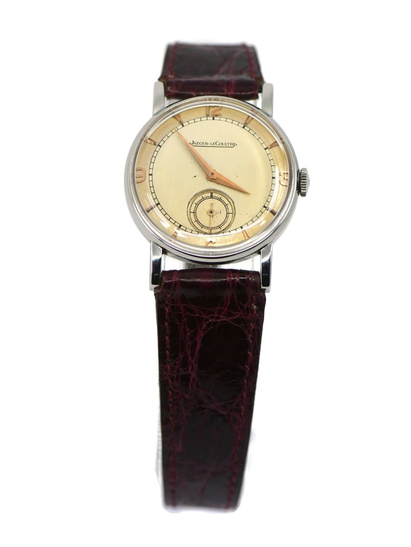 Jaeger-LeCoultre Vintage Stainless Steel Mechanical Watch with Aftermarket Strap: Jaeger-LeCoultre Vintage Stainless Steel Mechanical Watch with Aftermarket Strap This Jaeger LeCoultre vintage wristwatch showcases timeless elegance and craftsmanship. Featuring a mechanical (manual)