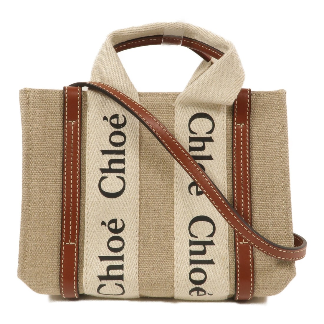 Chloe Woody Mini Canvas 2way Shoulder Tote Brown Beige: Chloe Woody Mini Canvas 2way Shoulder Tote Brown Beige Chloe Woody Mini tote bag in brown and beige canvas with a 2-way shoulder design. This women's bag features an open interior pocket and includes 