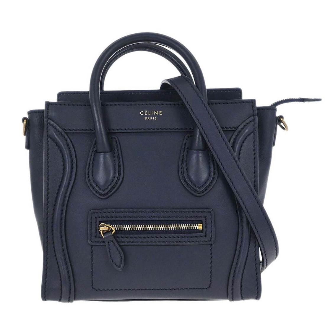 CELINE Nano Luggage Mini Leather Top Handle Bag with Strap Navy: CELINE Nano Luggage Mini Leather Top Handle Bag with Strap Navy Celine Nano Luggage 2way tote bag in navy leather with double handles, zip closure, and a detachable shoulder strap. This mini top handl
