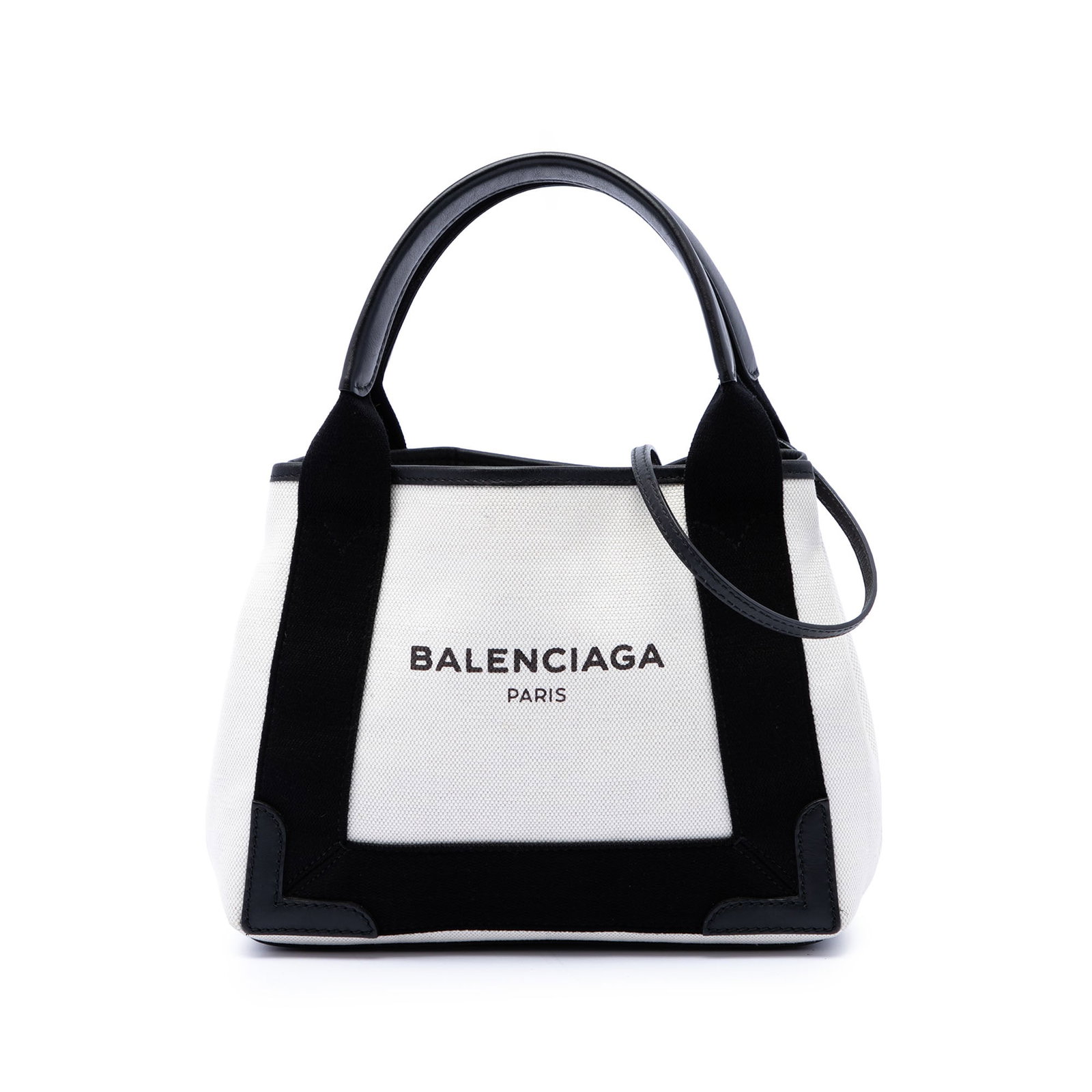 Balenciaga Navy Cabas XS Canvas Satchel with Strap: Balenciaga Navy Cabas XS Canvas Satchel with Strap Balenciaga Navy Cabas XS satchel crafted with a canvas body and leather trim. The bag features flat leather handles, a detachable strap, an open top,