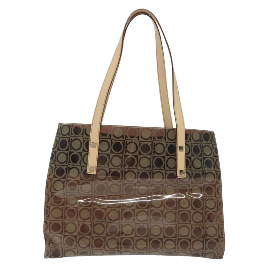 Gancini Brown Vinyl Tote Bag by Salvatore Ferragamo: Gancini Brown Vinyl Tote Bag by Salvatore Ferragamo This Salvatore Ferragamo Gancini Tote is crafted from durable brown plastic and features a spacious design suitable for everyday use. Made in Italy,