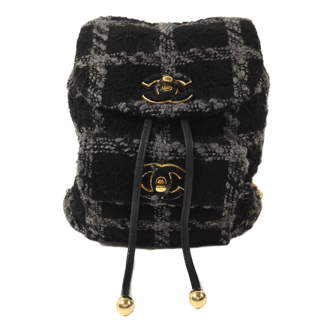 CHANEL Duma Tweed Rucksack Backpack Black with CC Gold Tone Chain: CHANEL Duma Tweed Rucksack Backpack Black with CC Gold Tone Chain A CHANEL Duma tweed chain backpack in black, presented in very good AB condition. This rucksack-style backpack features tweed exterior
