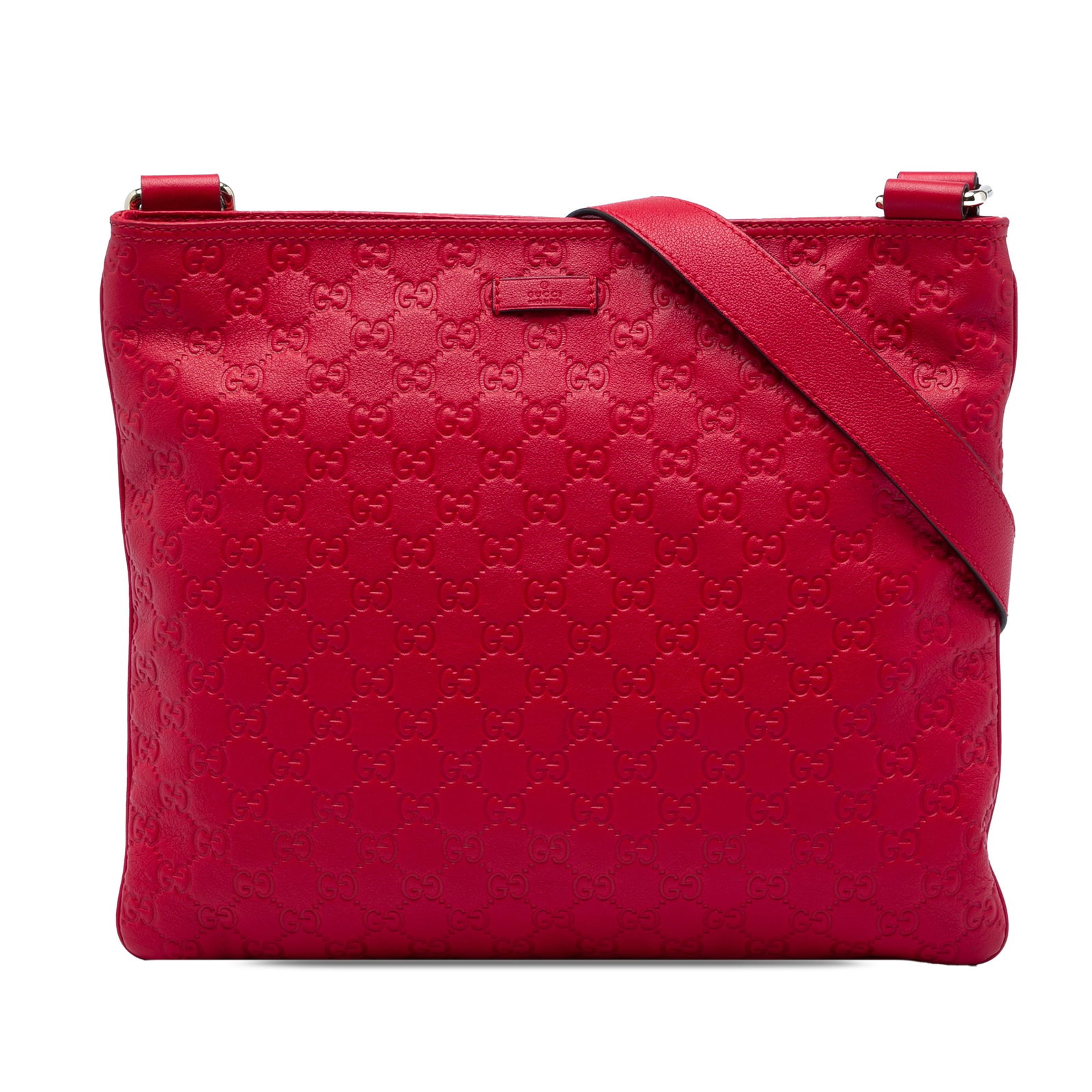 Gucci Guccissima leather crossbody bag in red: Gucci Guccissima leather crossbody bag in red Gucci Guccissima Crossbody bag in red embossed leather with an adjustable flat leather strap, top zip closure, and interior zip and slip pockets. Made in 