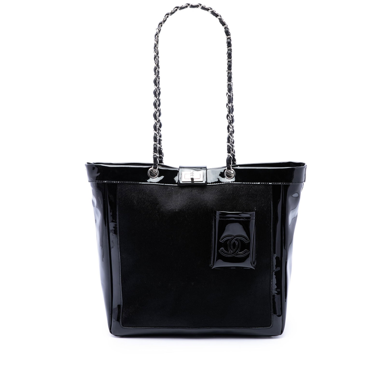 Chanel Mademoiselle Turnlock Tote in Pony Hair and Patent Leather: Chanel Mademoiselle Turnlock Tote in Pony Hair and Patent Leather Chanel Mademoiselle Turnlock tote crafted with a pony hair body and patent leather trim. The bag features a leather-woven chain link s