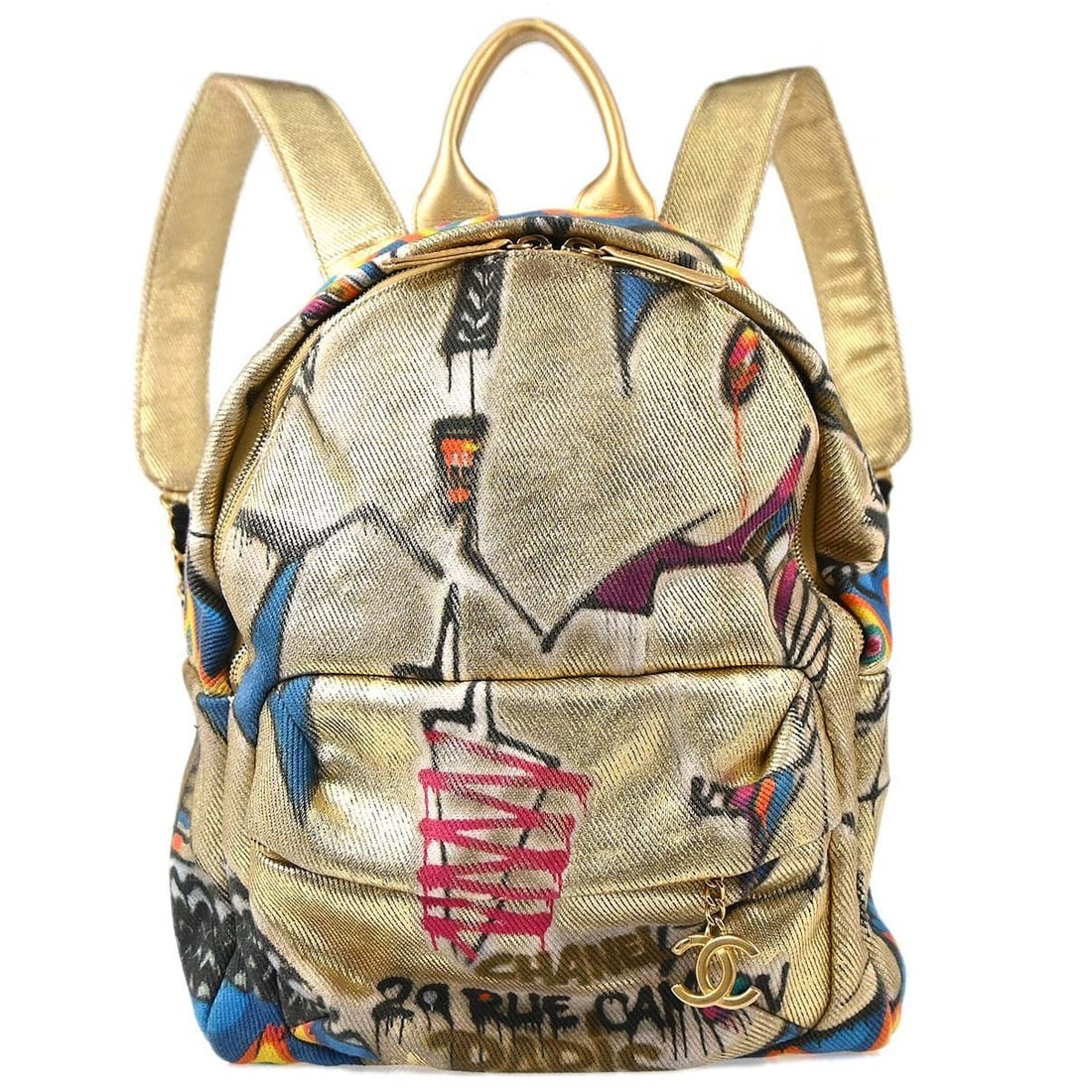 CHANEL Spirit Graffiti Backpack Gold Canvas Large Italy: CHANEL Spirit Graffiti Backpack Gold Canvas Large Italy Chanel Spirit backpack in gold canvas with a zip closure and a large, structured silhouette. The bag features one exterior zip pocket and one in