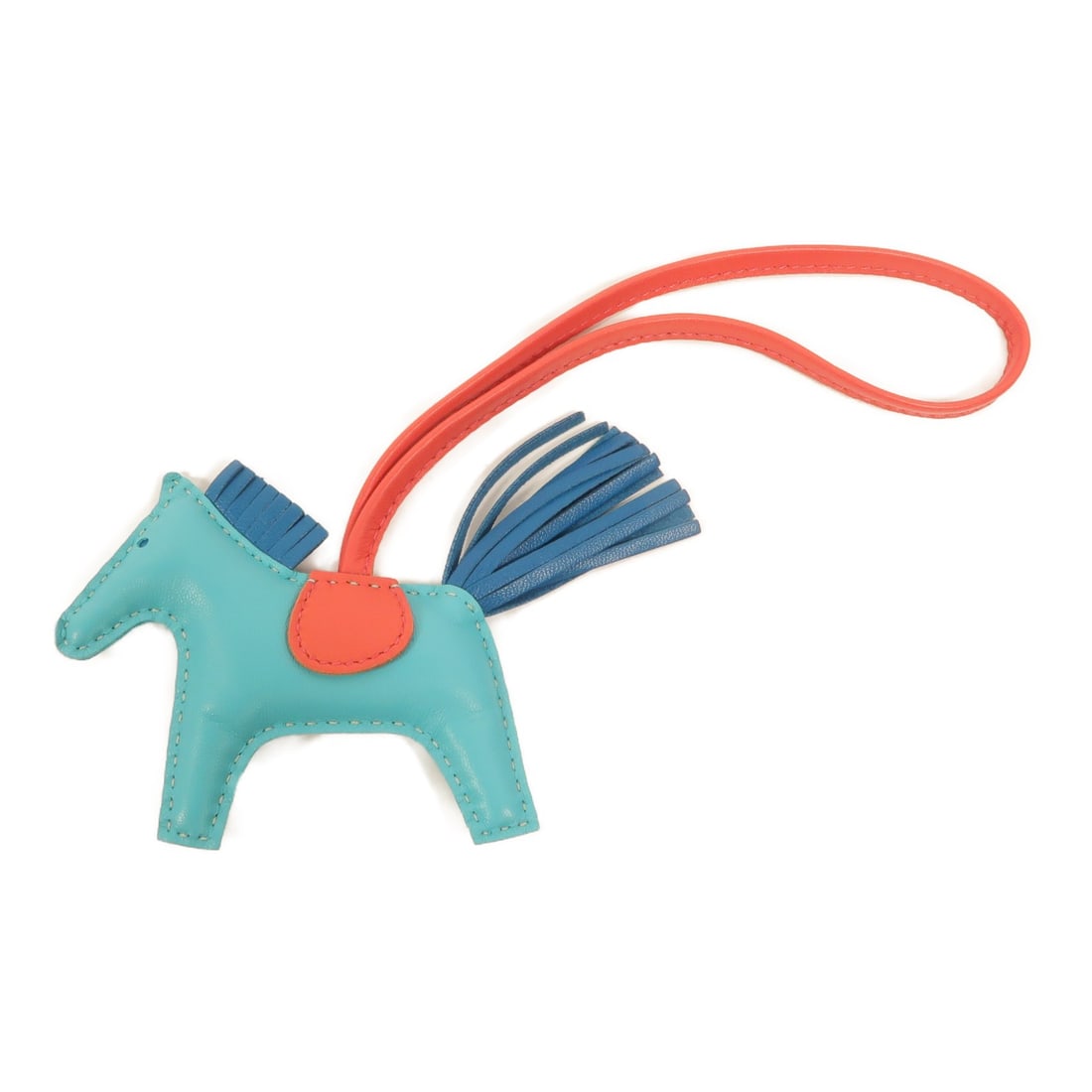 Hermes Rodeo PM Milo Lambskin Bag Charm Lagon Bleu Izmir Bougainvillier: Hermes Rodeo PM Milo Lambskin Bag Charm Lagon Bleu Izmir Bougainvillier Hermes Rodeo PM charm made from Milo lambskin (sheep leather) in Lagon, Bleu Izmir, and Bougainvillier. The item is identified a