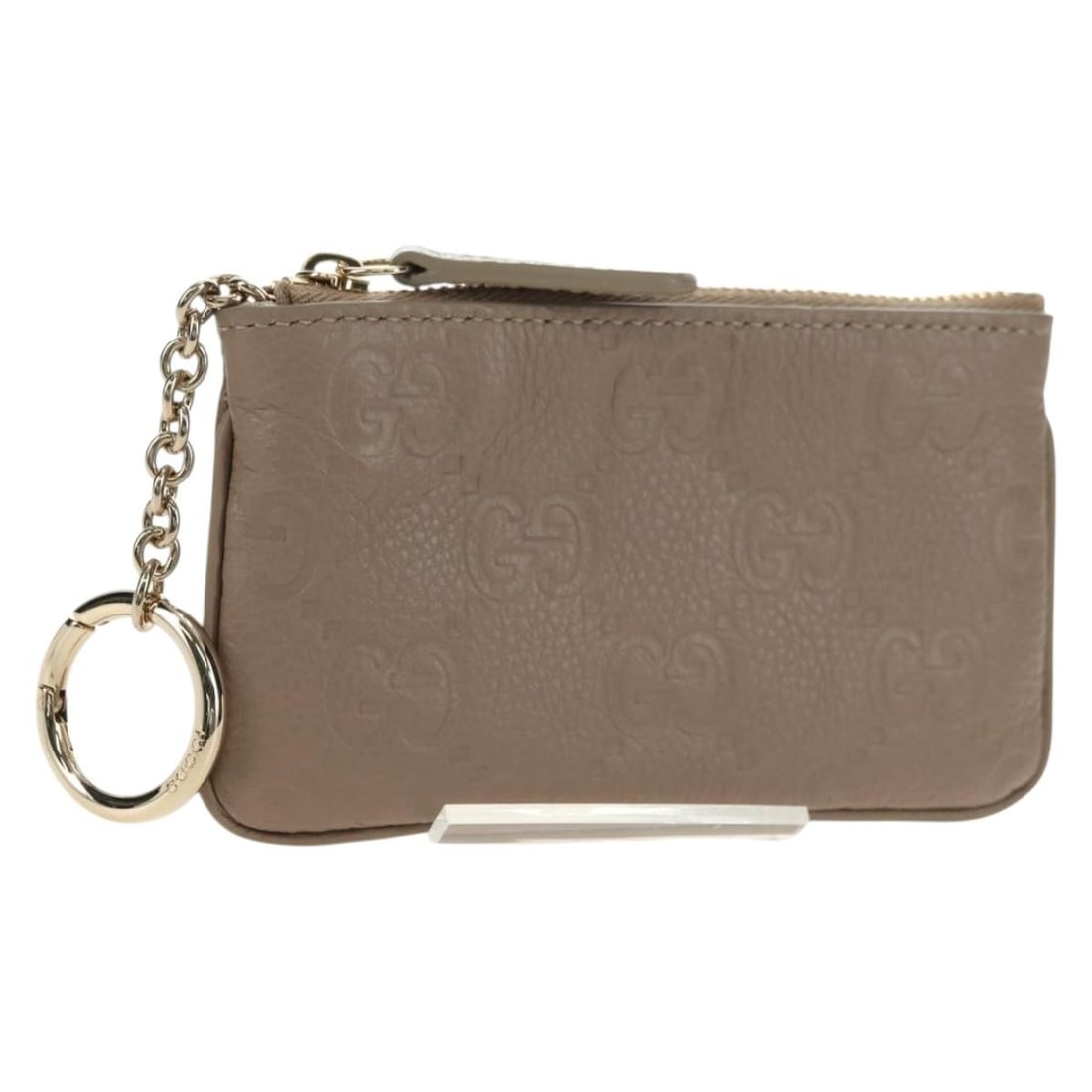 Gucci 815891 leather key case GG Emblem beige gold: Gucci 815891 leather key case GG Emblem beige gold Authentic Gucci GG Emblem key pouch in beige and gold with a leather and GG canvas construction. Made in Italy, this women's key case includes the du