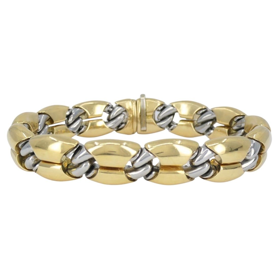 Bulgari Oro Acciaio 18k Gold and Steel Link Bracelet: Bulgari Oro Acciaio 18k Gold and Steel Link Bracelet Vintage Bvlgari link bracelet crafted in 18k yellow gold and steel with a modular link construction and concealed clasp. The piece is stamped BVLGA