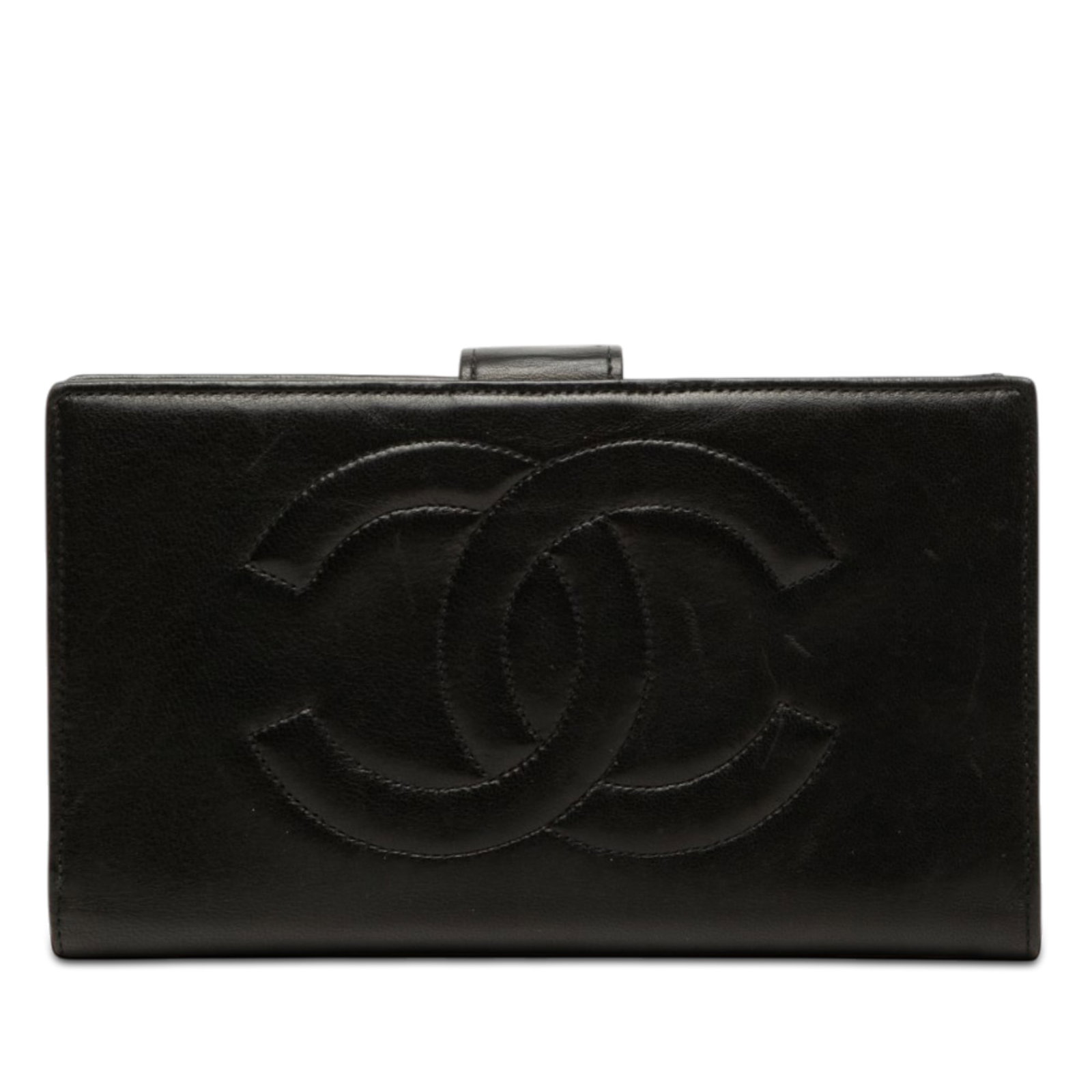 Chanel CC Bifold Long Wallet in Black Lambskin: Chanel CC Bifold Long Wallet in Black Lambskin A Chanel CC Lambskin Bifold Long Wallet in black, made in France. This long wallet features a lambskin leather body, top strap with snap button closure, 