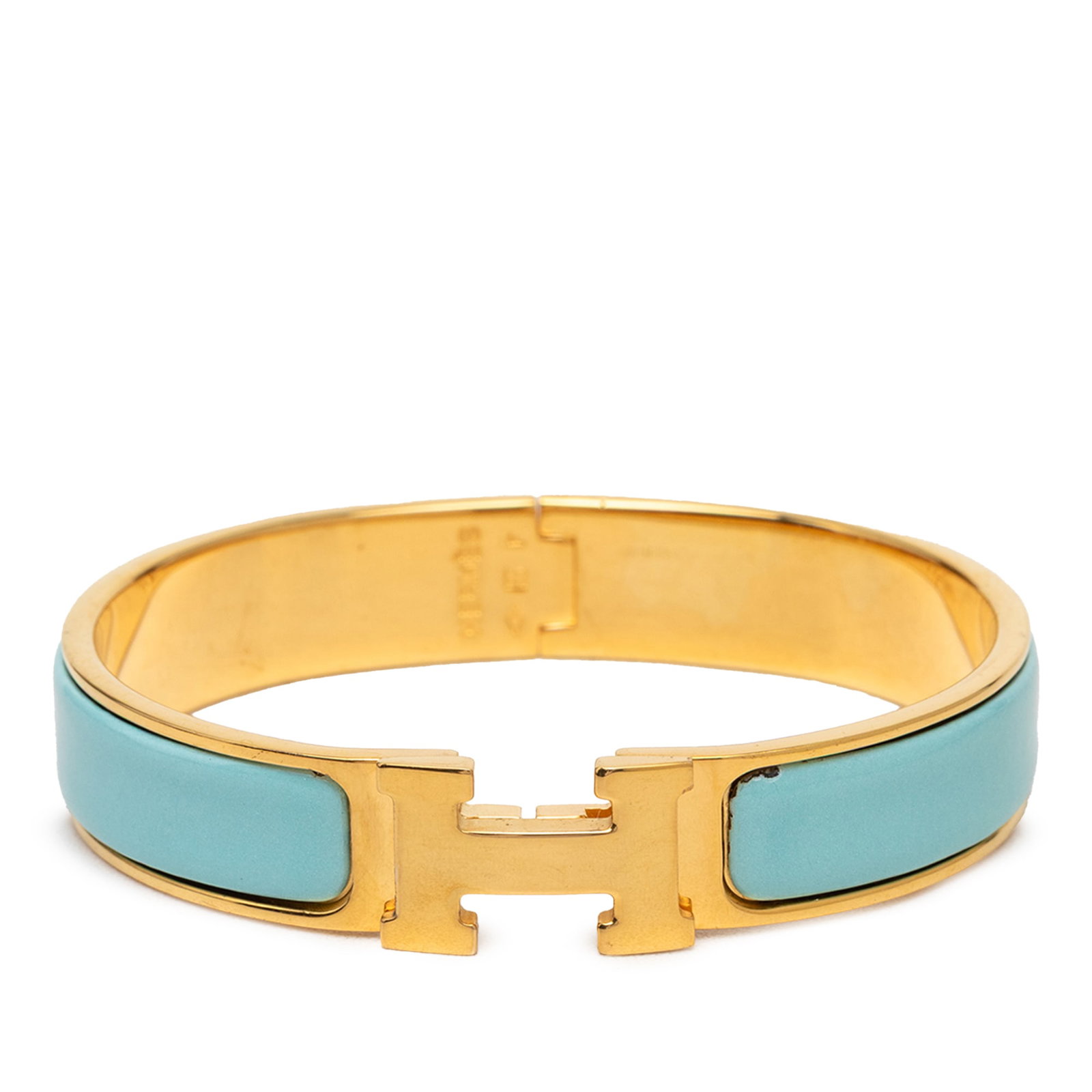 Hermes Clic H GM narrow enamel bracelet blue gold tone: Hermes Clic H GM narrow enamel bracelet blue gold tone Hermes Narrow Enamel Clic H Bracelet GM featuring an enamel body with gold-tone metal hardware and a metal clasp closure. This bracelet is made i