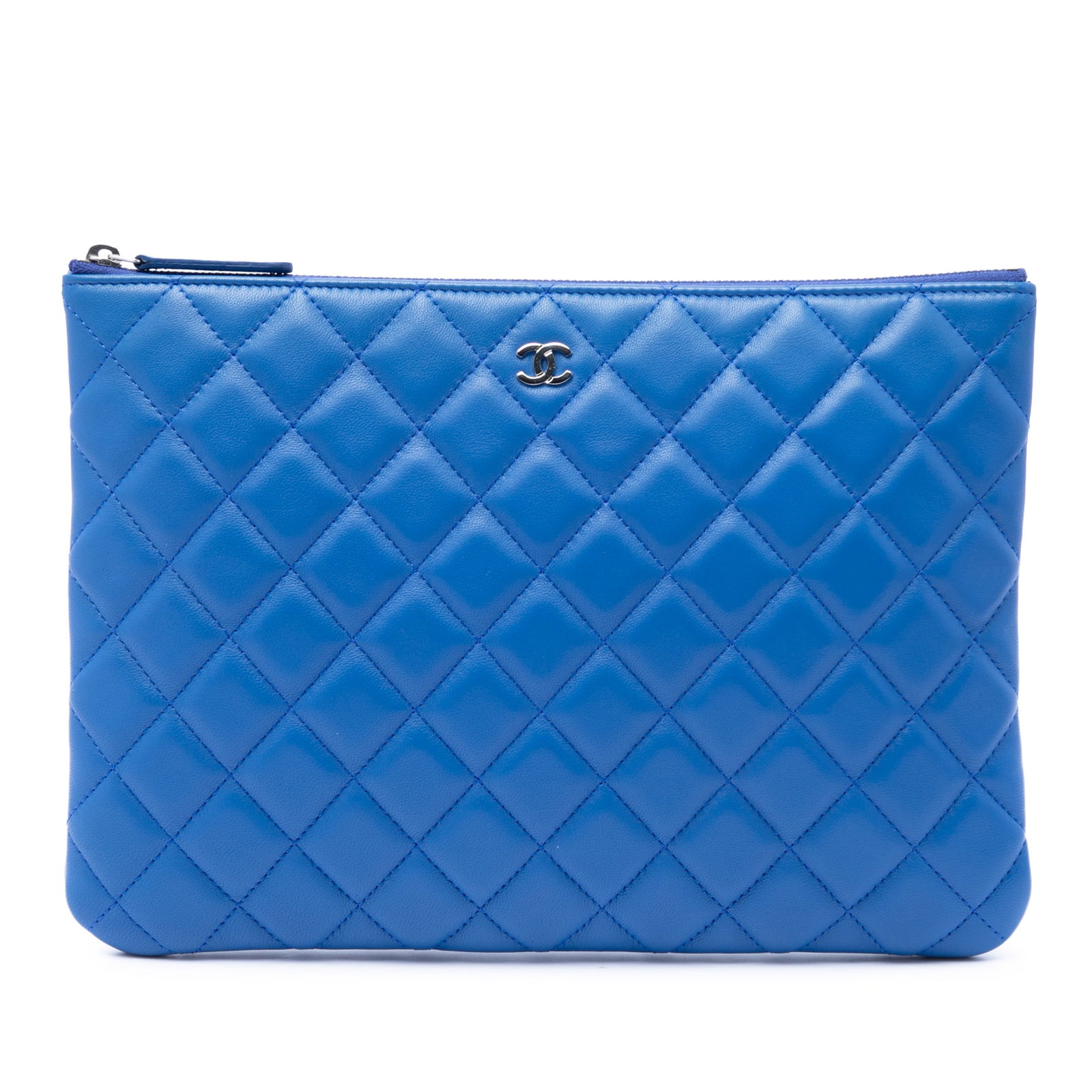Chanel O Case Medium Blue Quilted Lambskin Clutch: Chanel O Case Medium Blue Quilted Lambskin Clutch Medium Chanel O Case clutch crafted in quilted lambskin leather with a top zip closure. This blue clutch is made in Italy and includes a dust bag and 