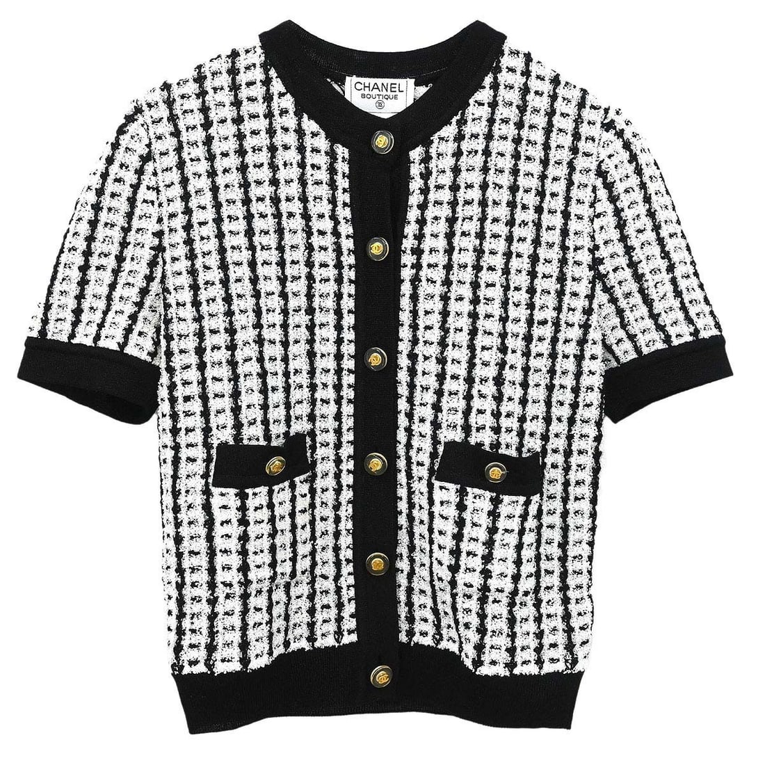 Vintage CHANEL IT 42 Black Short Sleeve Knit Cardigan: Vintage CHANEL IT 42 Black Short Sleeve Knit Cardigan Vintage Chanel short-sleeve knit cardigan in black with button accents and two exterior pockets. This women's regular-fit cardigan is made in Ital