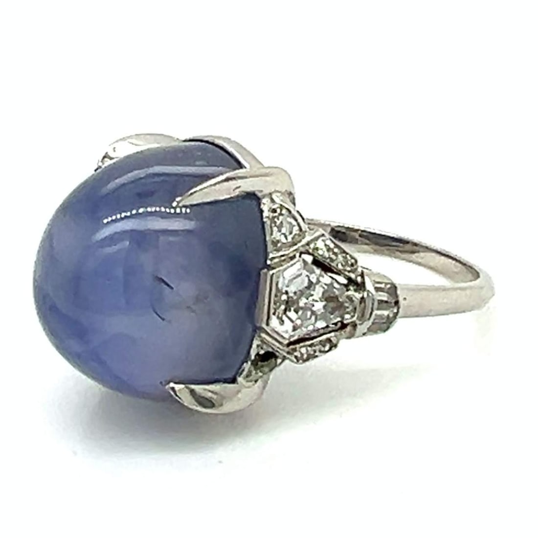 Art Deco Platinum Ring 35 Ct Star Sapphire 1.50 Ct Diamonds: Art Deco Platinum Ring 35 Ct Star Sapphire 1.50 Ct Diamonds This exquisite Art Deco ring features a stunning 35.00 Ct. star sapphire, beautifully set in luxurious platinum. The ring is accented with a