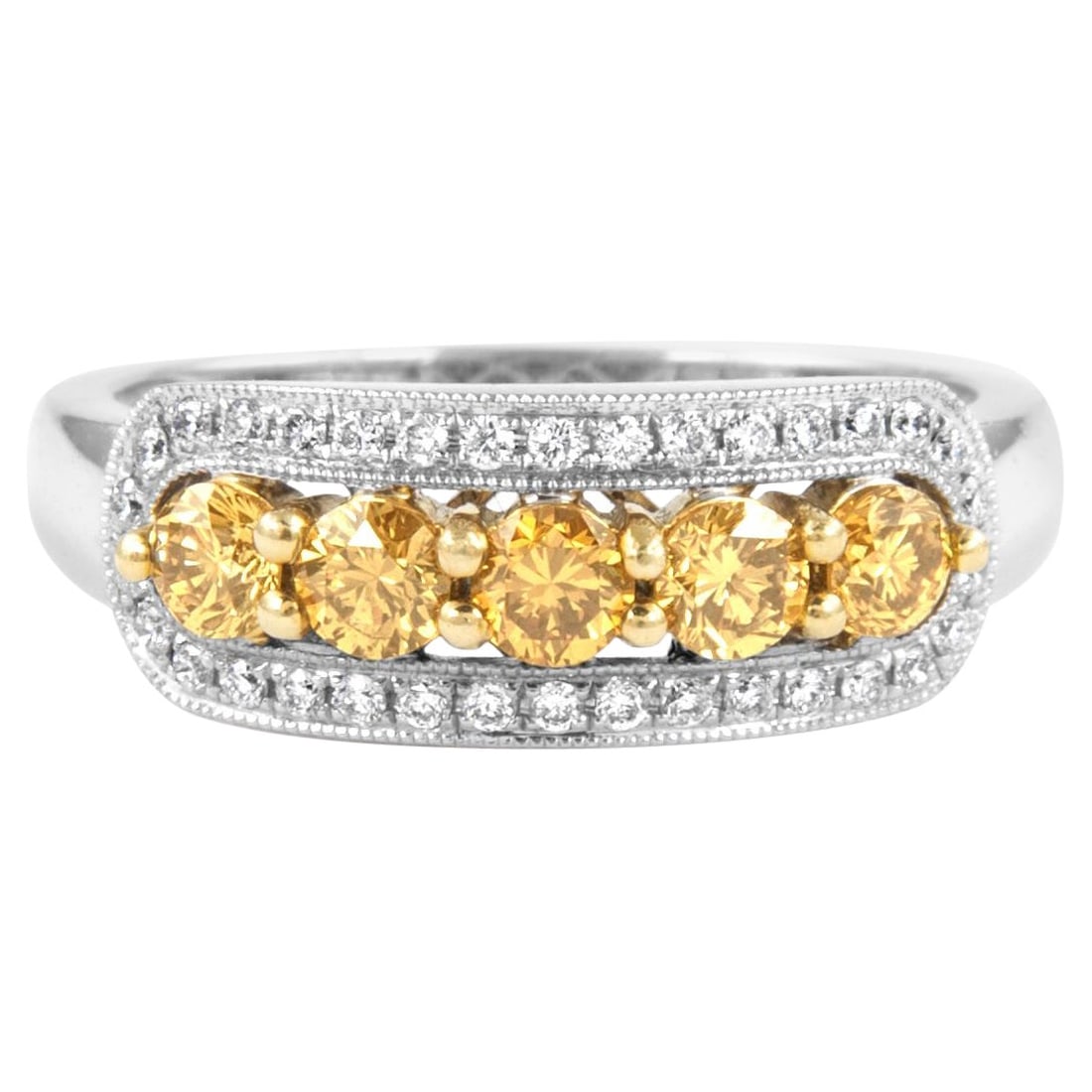 0.83ct Fancy Intense Yellow Diamond Ring 18k Two-Tone: 0.83ct Fancy Intense Yellow Diamond Ring 18k Two-Tone This stunning cocktail ring features a captivating 0.83ct Fancy Intense Yellow diamond, beautifully complemented by a modern two-tone design craft