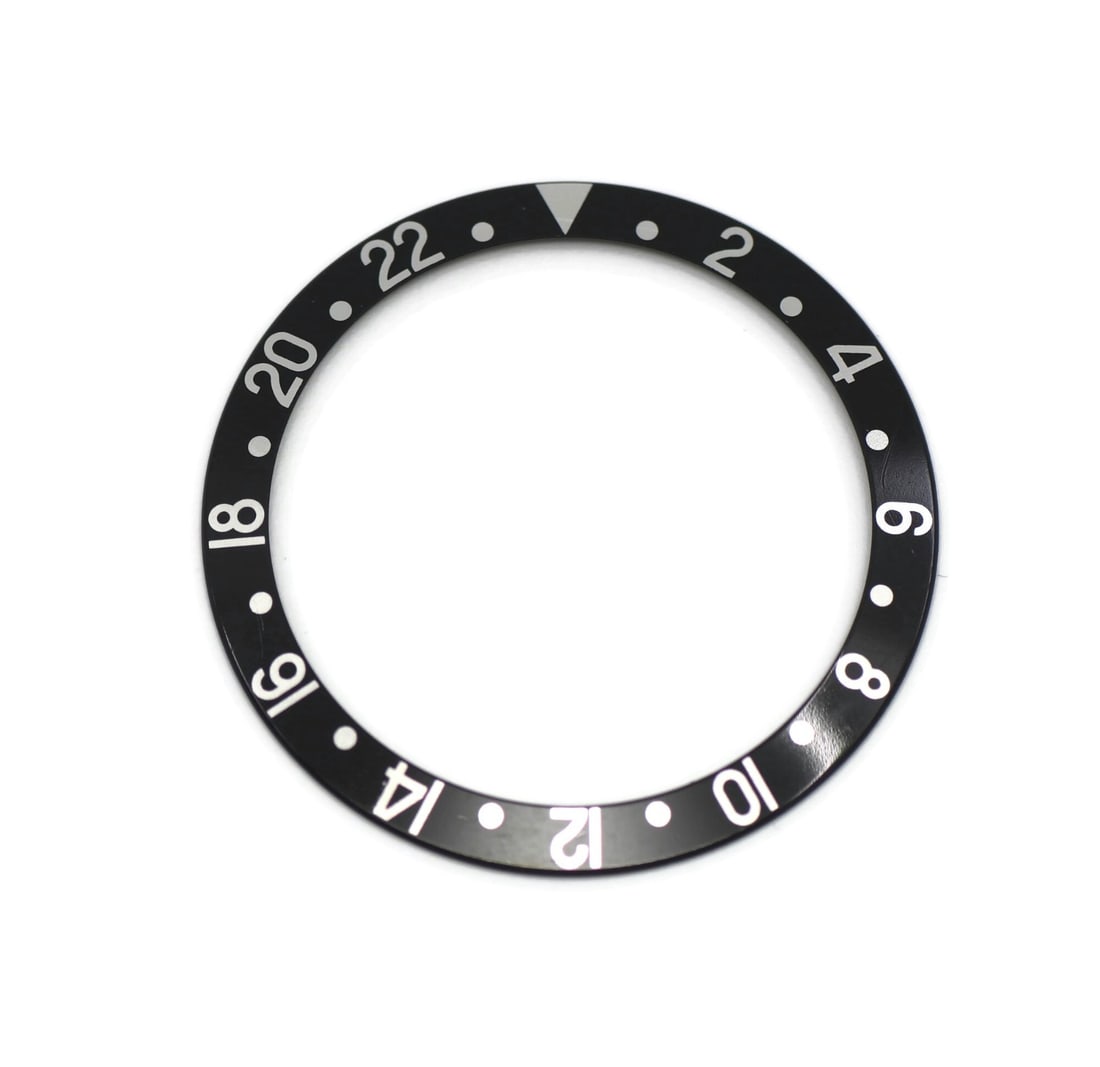 Rolex 16710 GMT Master bezel insert: Rolex 16710 GMT Master bezel insert Pre-owned Rolex GMT-Master insert 16710. This Switzerland-made insert is described as compatible with the Rolex GMT-Master and is noted as 100% authentic. Specifica