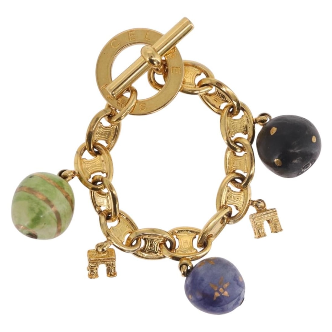 CELINE gold tone metal bracelet with box and dust bag: CELINE gold tone metal bracelet with box and dust bag Celine Macadam bracelet in gold-tone metal for women. Made in Italy, this bracelet includes the dust bag and item box. Condition is ranked B, show