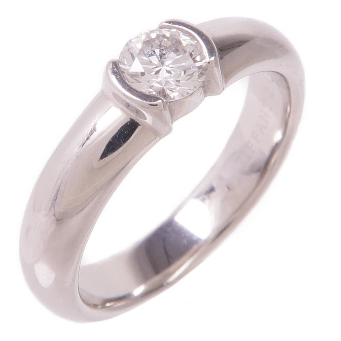Tiffany and Co PT950 Platinum Diamond Ring Size 4.75: Tiffany and Co PT950 Platinum Diamond Ring Size 4.75 A Tiffany & Co. diamond ring in Pt950 platinum, designed in a regular women's size 4.75. The ring is described as clear in color and features a dia