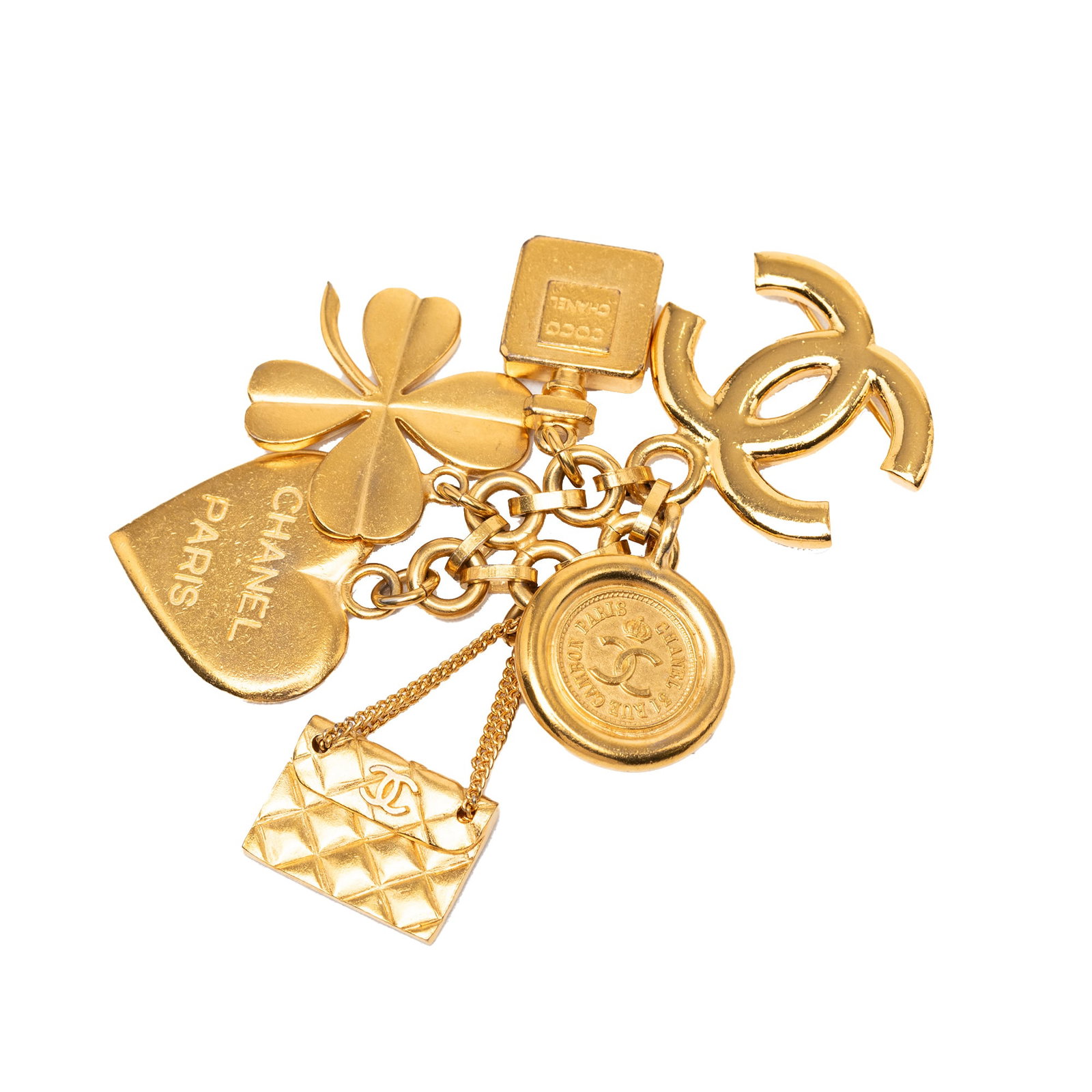 Chanel CC charm brooch gold plated metal pin: Chanel CC charm brooch gold plated metal pin Chanel CC icon charm pin brooch in gold-plated metal with a back pin closure. This costume jewelry piece is made in France and shows wear consistent with c