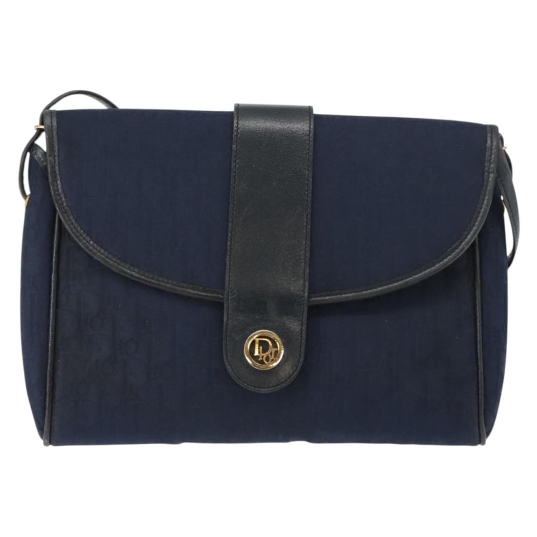 Christian Dior Vintage Trotter Shoulder Bag Navy Canvas: Christian Dior Vintage Trotter Shoulder Bag Navy Canvas This Christian Dior Vintage Trotter shoulder bag is crafted from navy canvas and designed for women. The bag features leather and metal fittings