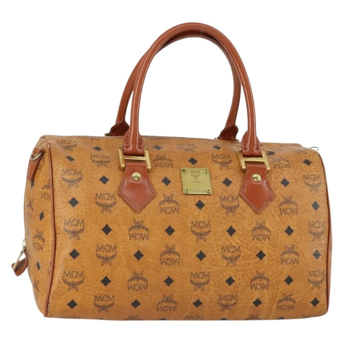 MCM Vicetos Boston Bag Brown Gold PVC Leather Germany: MCM Vicetos Boston Bag Brown Gold PVC Leather Germany Authentic MCM Vicetos logogram Boston bag in brown and gold PVC leather. This women's handbag is made in Germany and features a structured Boston 