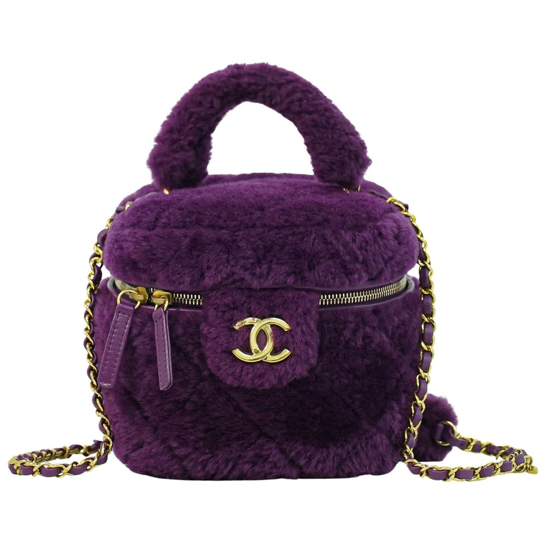 Chanel Coconing Vanity Case Faux Fur Quilted Purple Top Handle with Chain: Chanel Coconing Vanity Case Faux Fur Quilted Purple Top Handle with Chain This Chanel Coconing Top Handle Vanity Case with Chain features a quilted faux fur exterior in a vibrant purple hue. Designed 