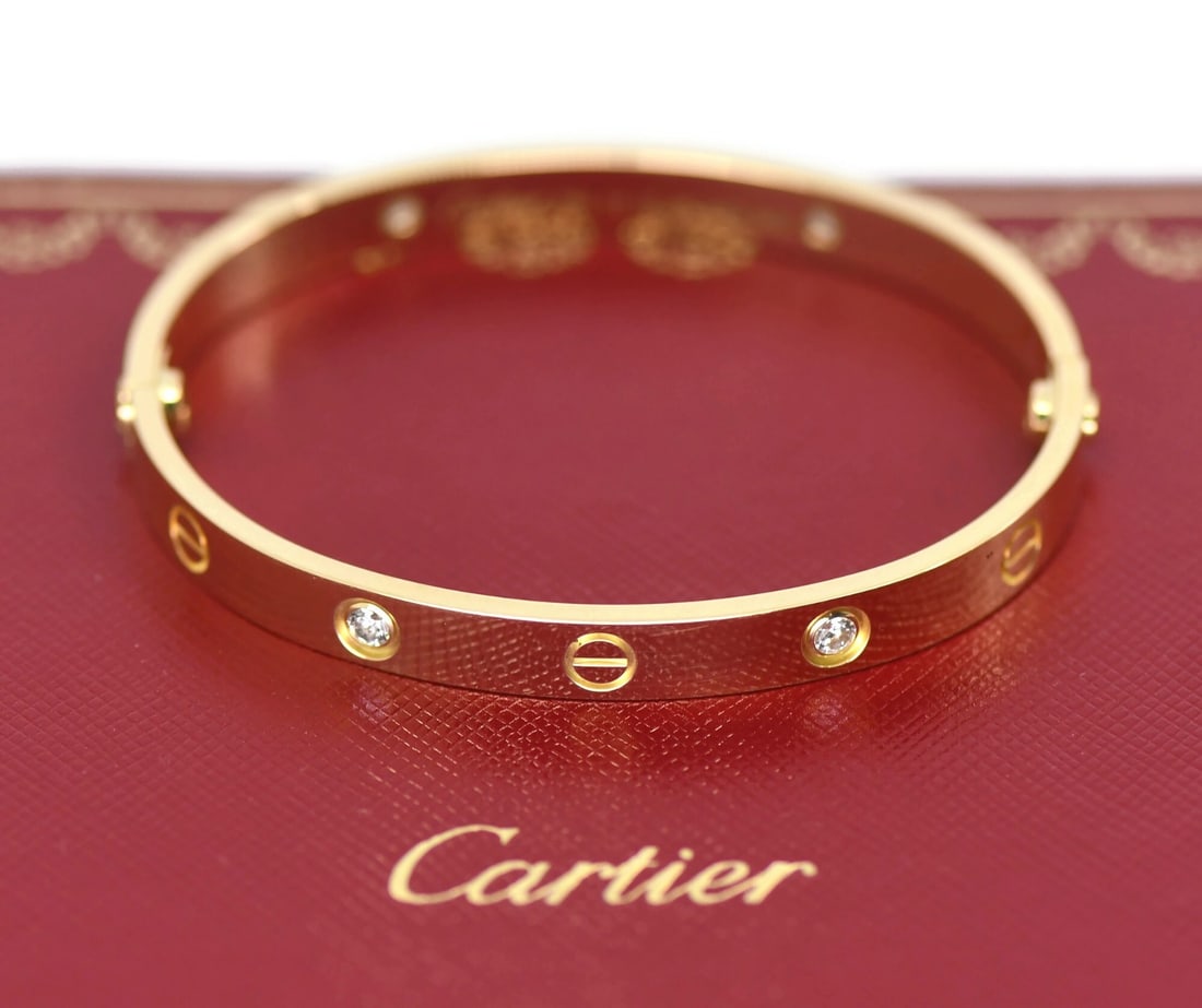 Cartier Love Bracelet 18K Yellow Gold 4 Diamond Bangle Size 17: Cartier Love Bracelet 18K Yellow Gold 4 Diamond Bangle Size 17 Pre-owned Cartier Love bracelet in 18K yellow gold with four diamonds. This bangle-style bracelet is made in France and comes with the pu