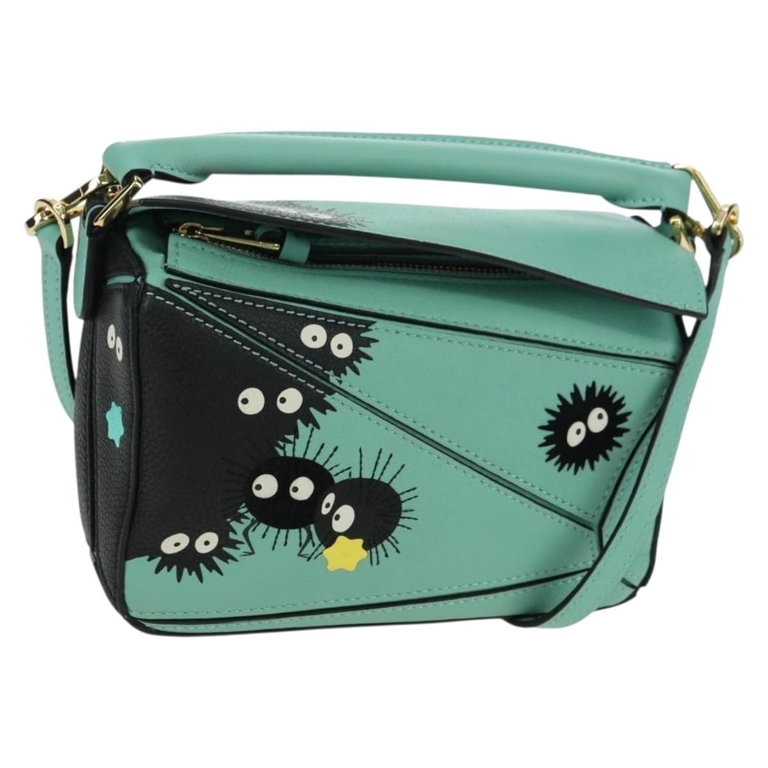 LOEWE Ghibli Soot Sprites Puzzle Mini 2way Leather Handbag Green: LOEWE Ghibli Soot Sprites Puzzle Mini 2way Leather Handbag Green This LOEWE x Ghibli Spirited Away Soot Sprites Puzzle Mini 2way handbag is crafted from leather in a mint green and gold colorway. It f