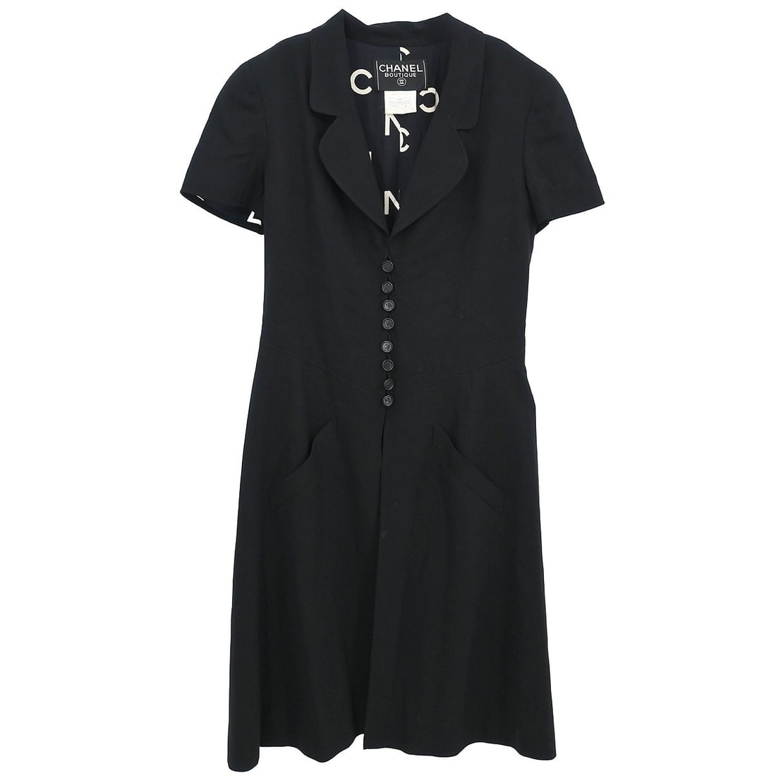 CHANEL 97P Black Wool Collared Short Dress Size 38: CHANEL 97P Black Wool Collared Short Dress Size 38 Black short-sleeve Chanel dress with a collared neckline and short length. Made from 100% wool, this women's regular-size dress features two exterior